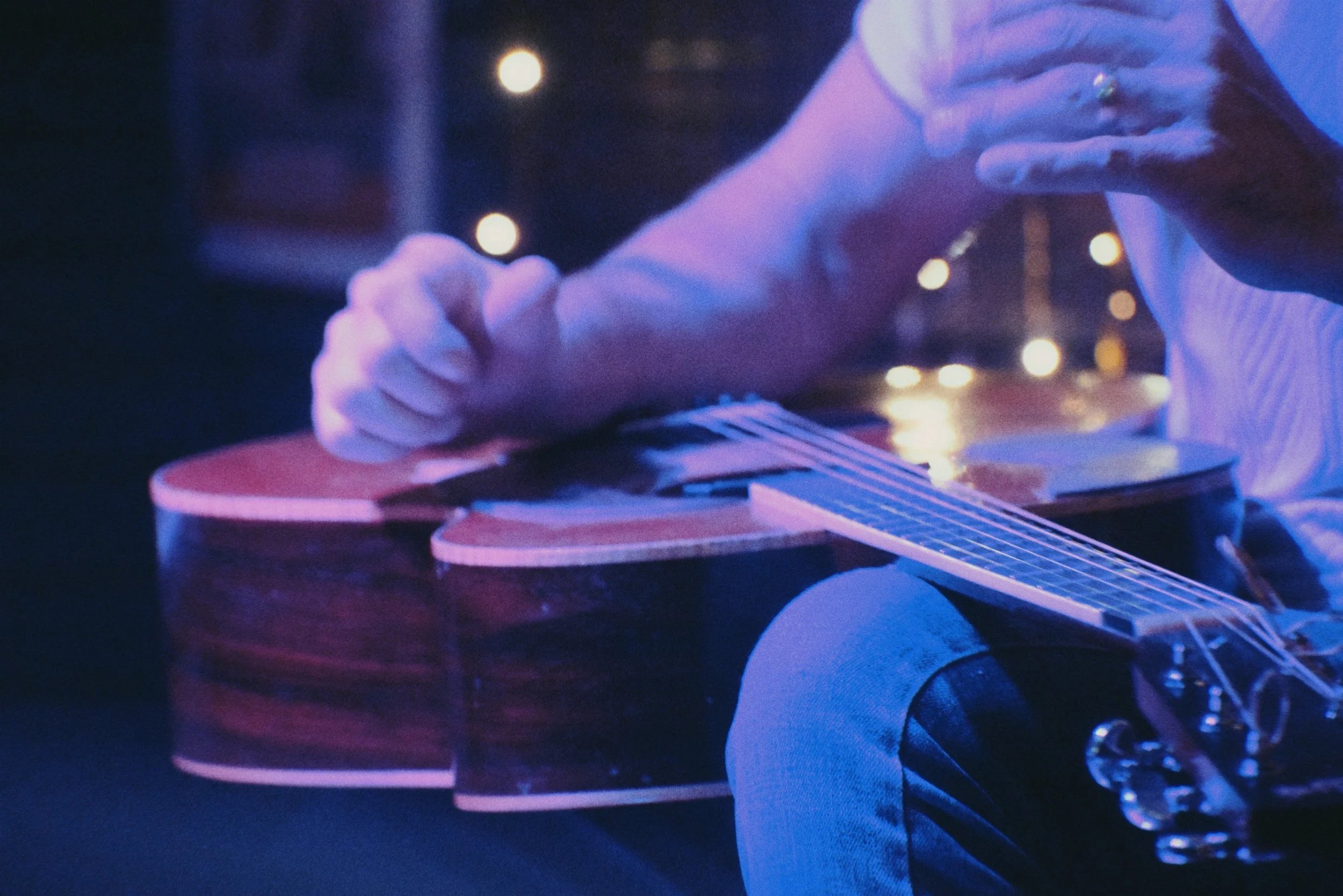 Michael Jordan plays his guitar in his lap at Stogies Cigar Bar in St. Augustine.