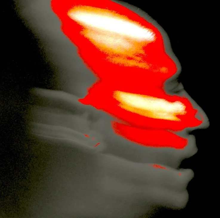 A side profile of a person's face with glow-effect overlay of bright orange and yellow streaks, resembling a stylized digital art piece.