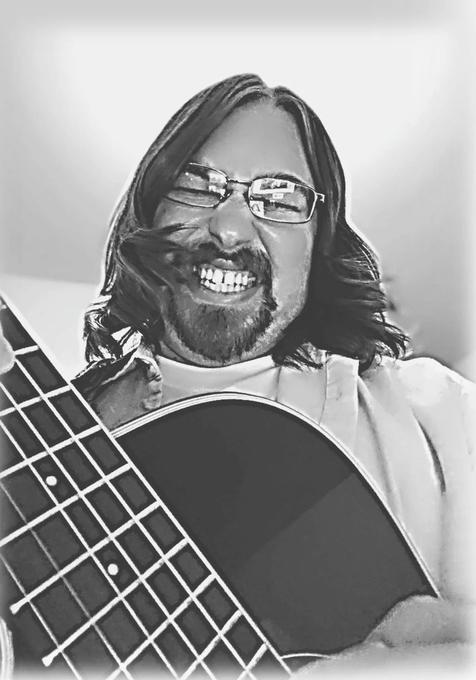 A close-up photo of a long-haired and bearded man playing the guitar