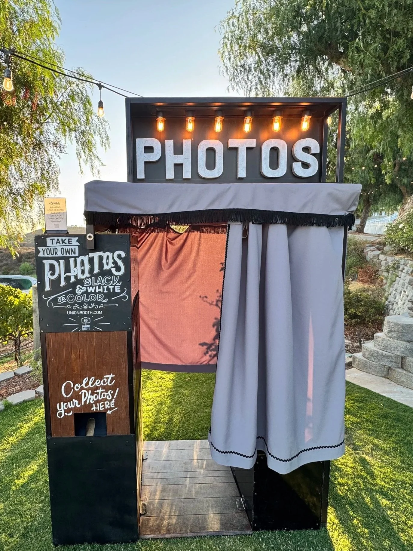 Enclosed photo booth with vintage vibes. Vintage photo booth, retro photo booth. Enclosed photo booth rentals in Orange County, Los Angeles, Inland Empire, San Diego, Palm Springs enclosed photo booth.