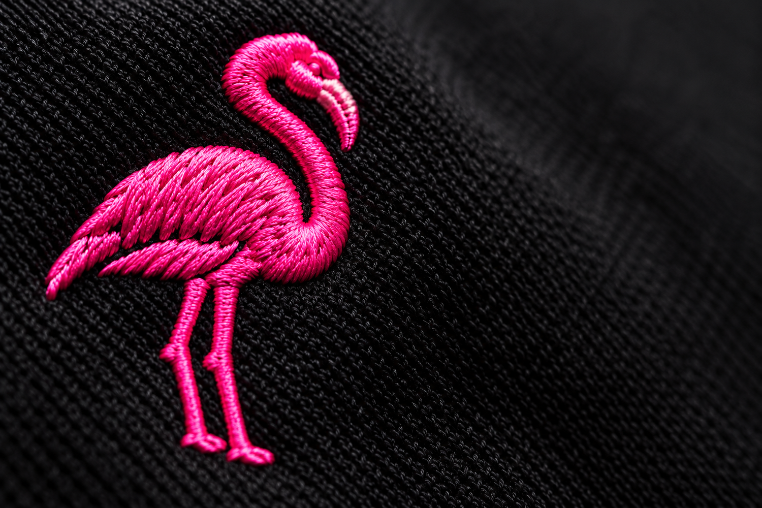 Close-up of pink embroidery showing the detail in each stitch