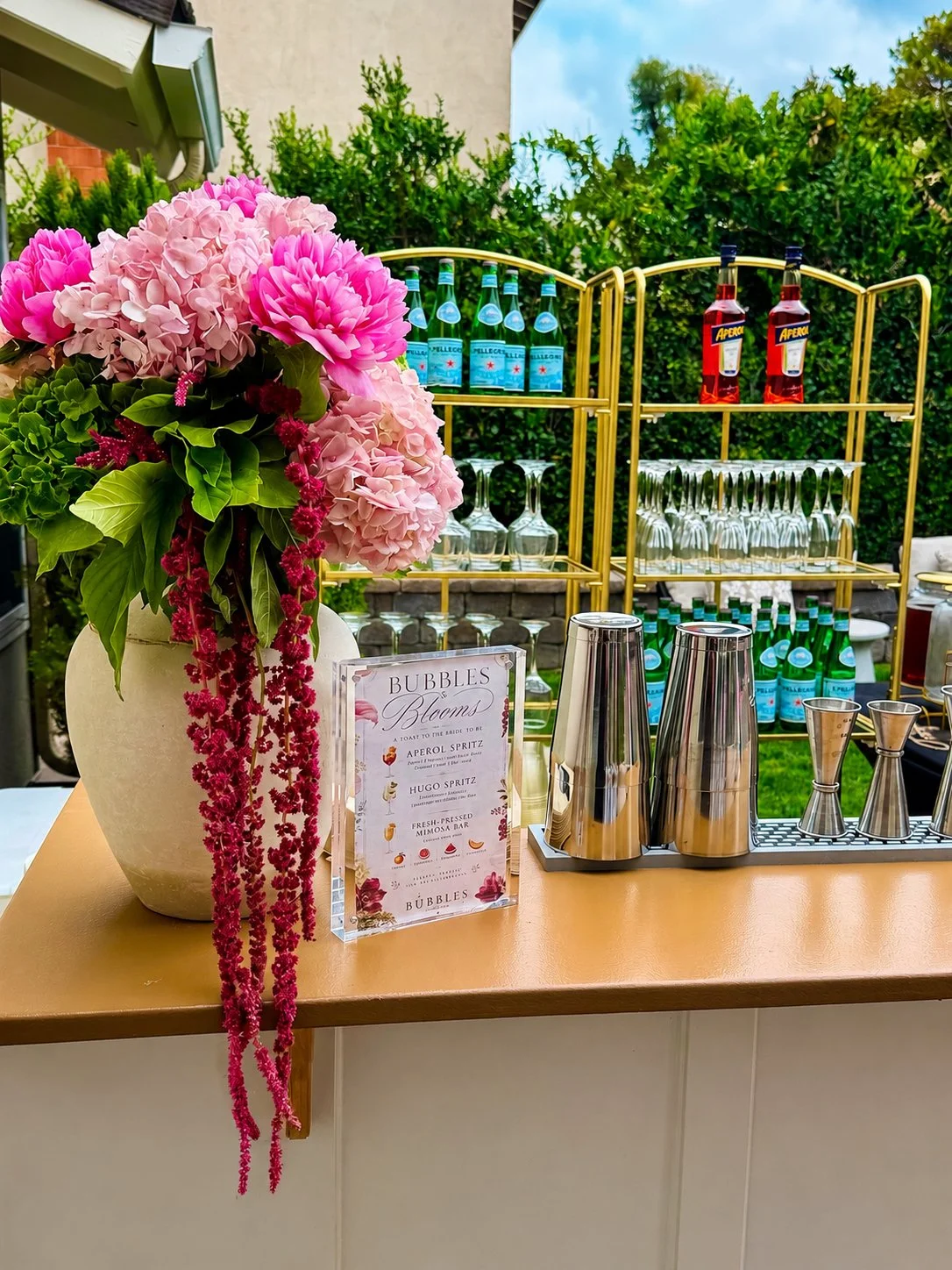 Fresh-pressed cocktail and mocktail bar served at a bridal shower in Orange County, CA. Custom seasonal drink menu, styled garnish display, and full bar setup by BUBBLES Mobile Bar.