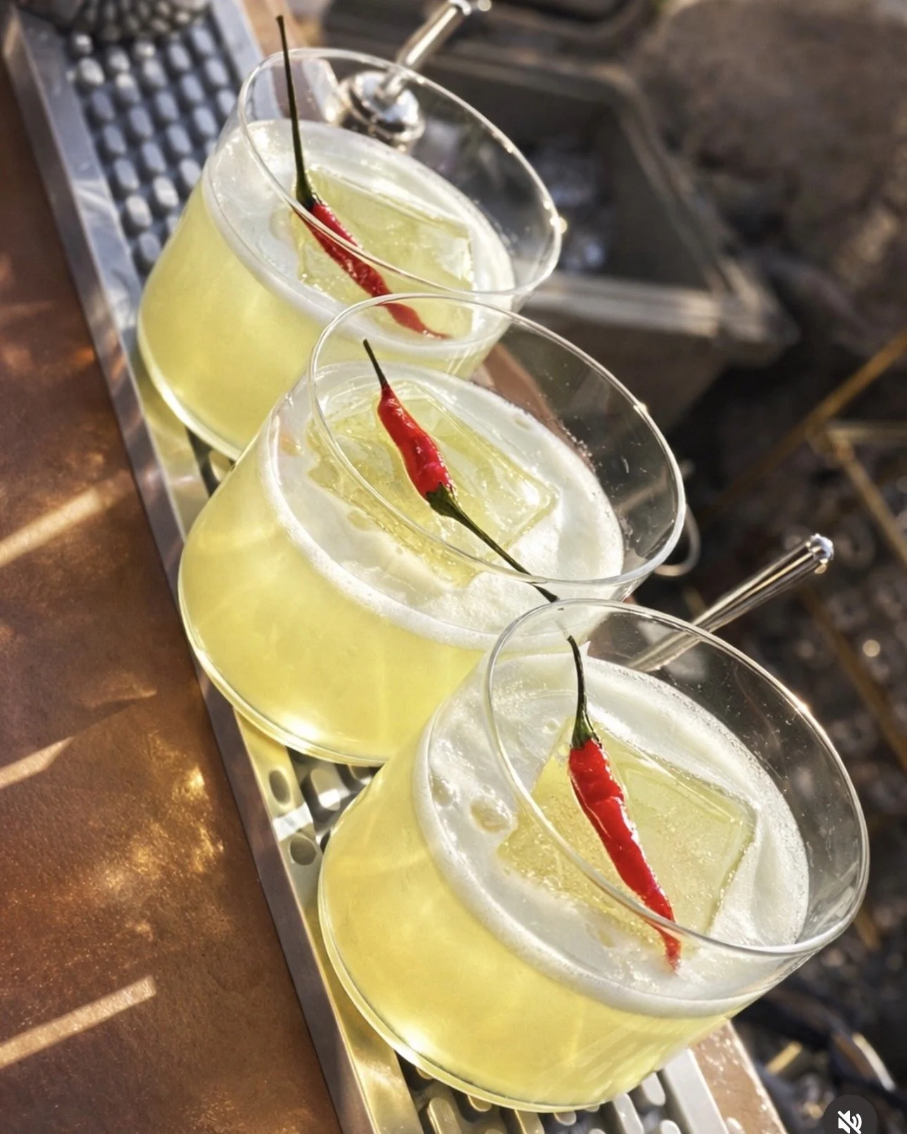 Custom spicy margarita crafted with fresh-pressed juice and served over a large format ice cube with Thai chili pepper infusion. Custom cocktail menu by BUBBLES Mobile Bar, Orange County, CA.