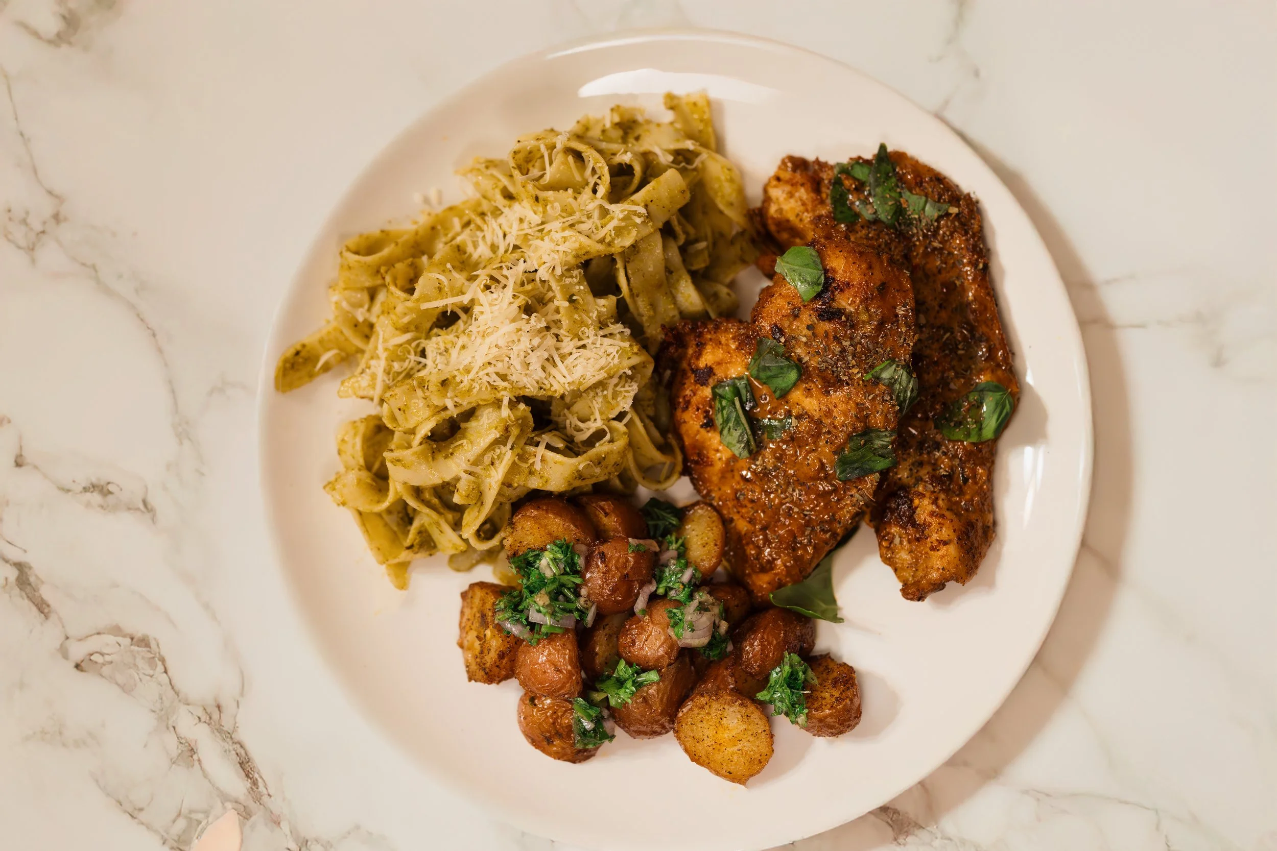 Creamy Garlic Chicken with Roasted Potatoes & Pesto Pasta