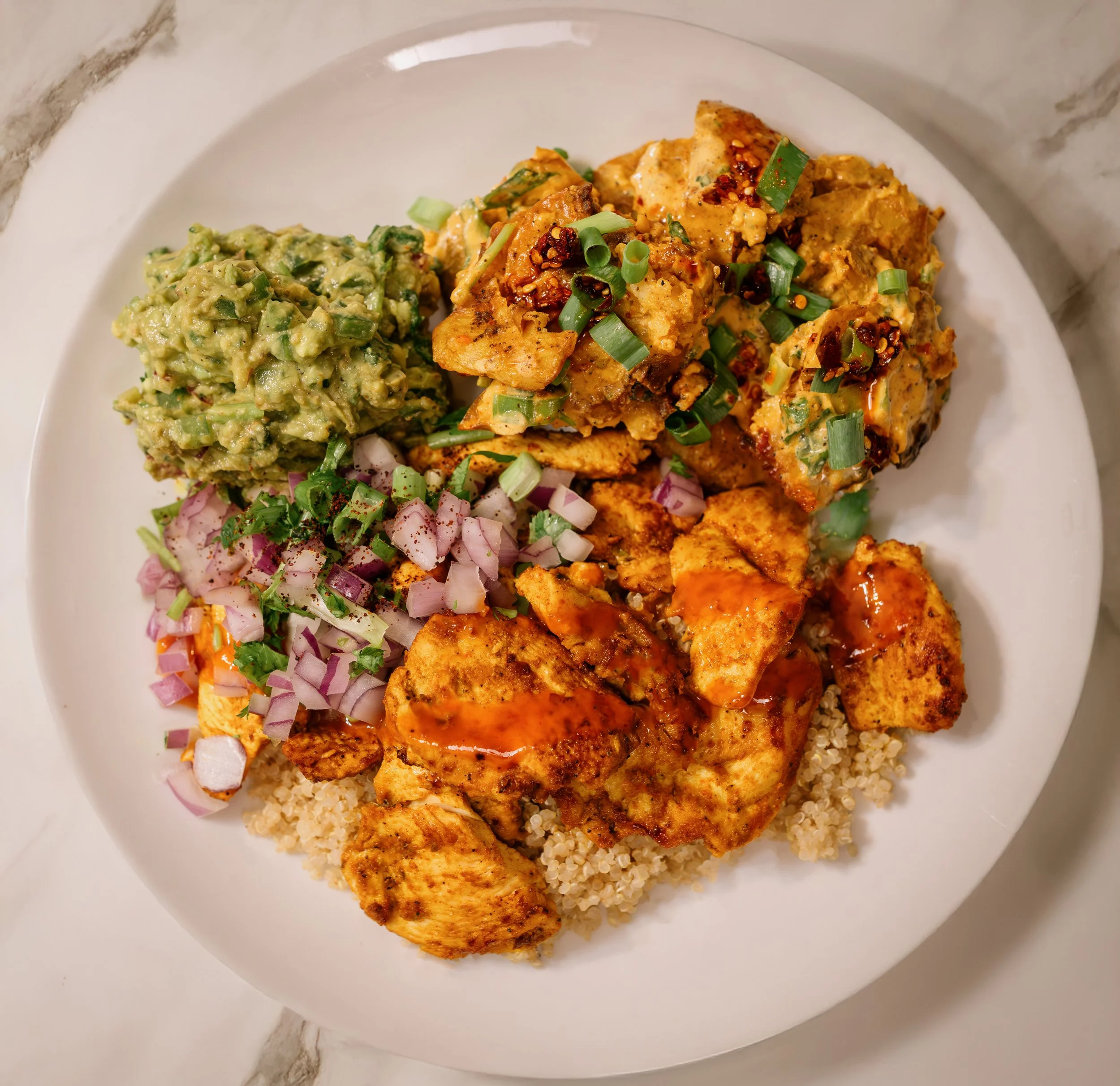 Baked Mediterranean Chicken with Crispy Chilli Crunch Potato Salad & Gaucamole over Quinoa