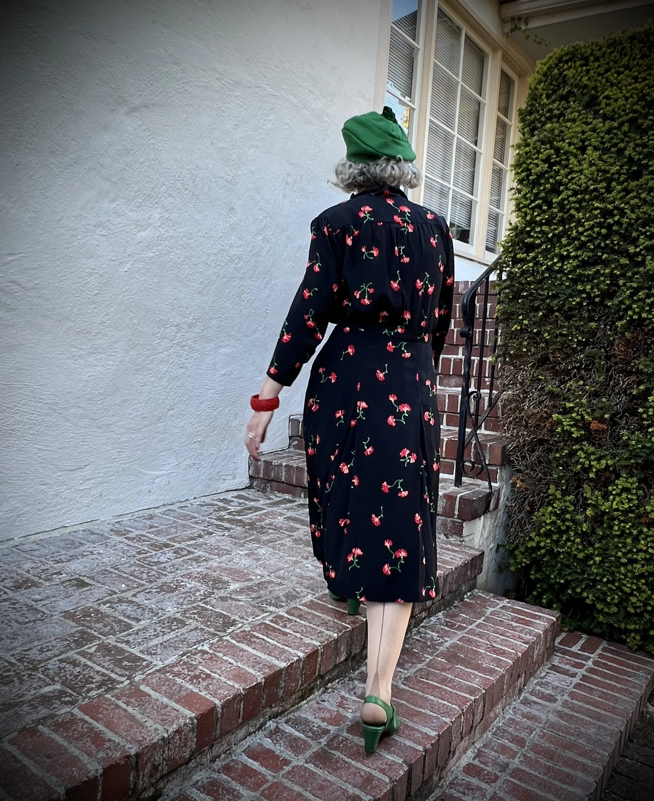 Back View of Jennifer Serr Walking up the stairs wearing a dress she made from a 1940's pattern, sewing, hand sewing, vintage sewing, vintage style, 1940s sewing pattern, 1940's dress