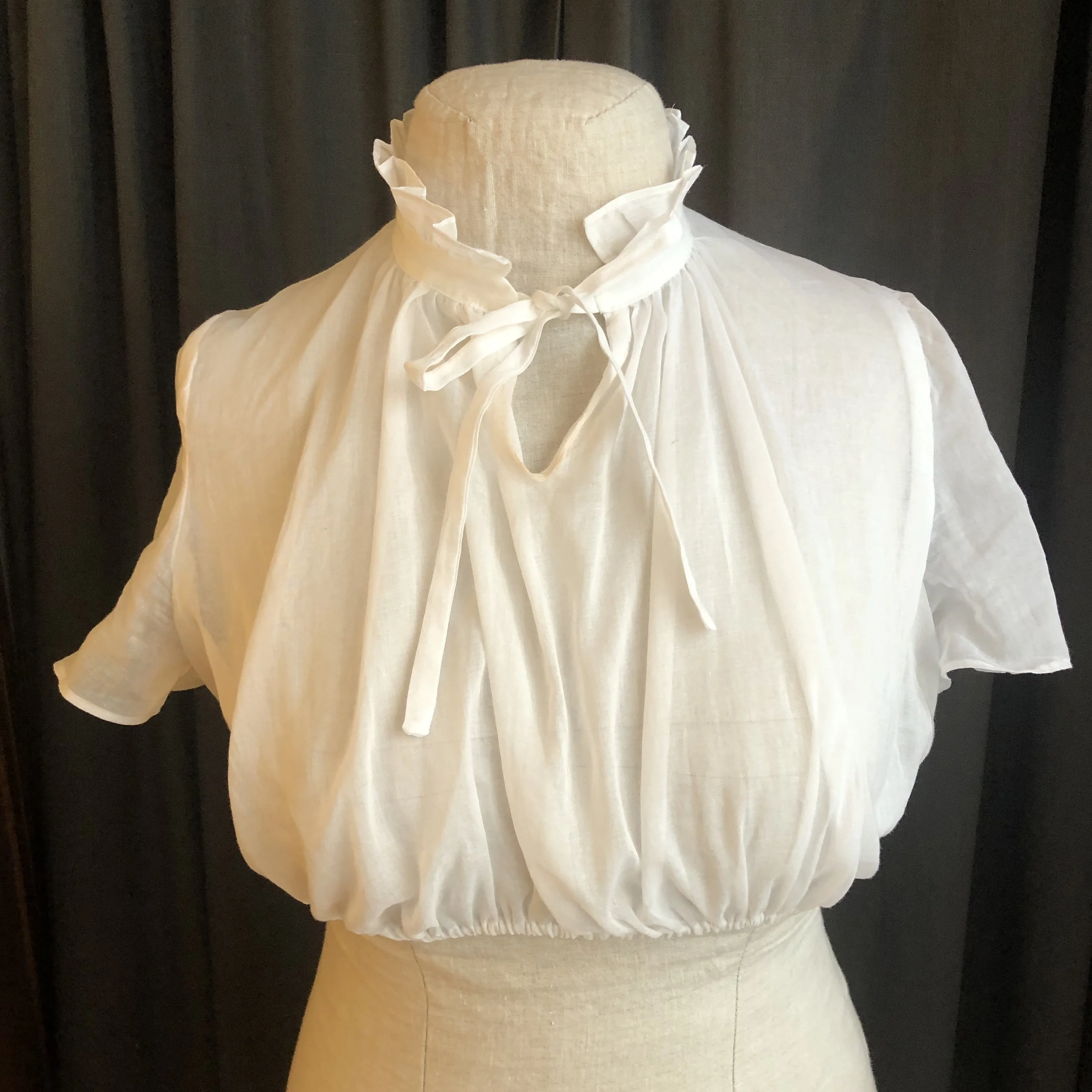 high neck dirndle blouse with collar and ruffle and short sleeves