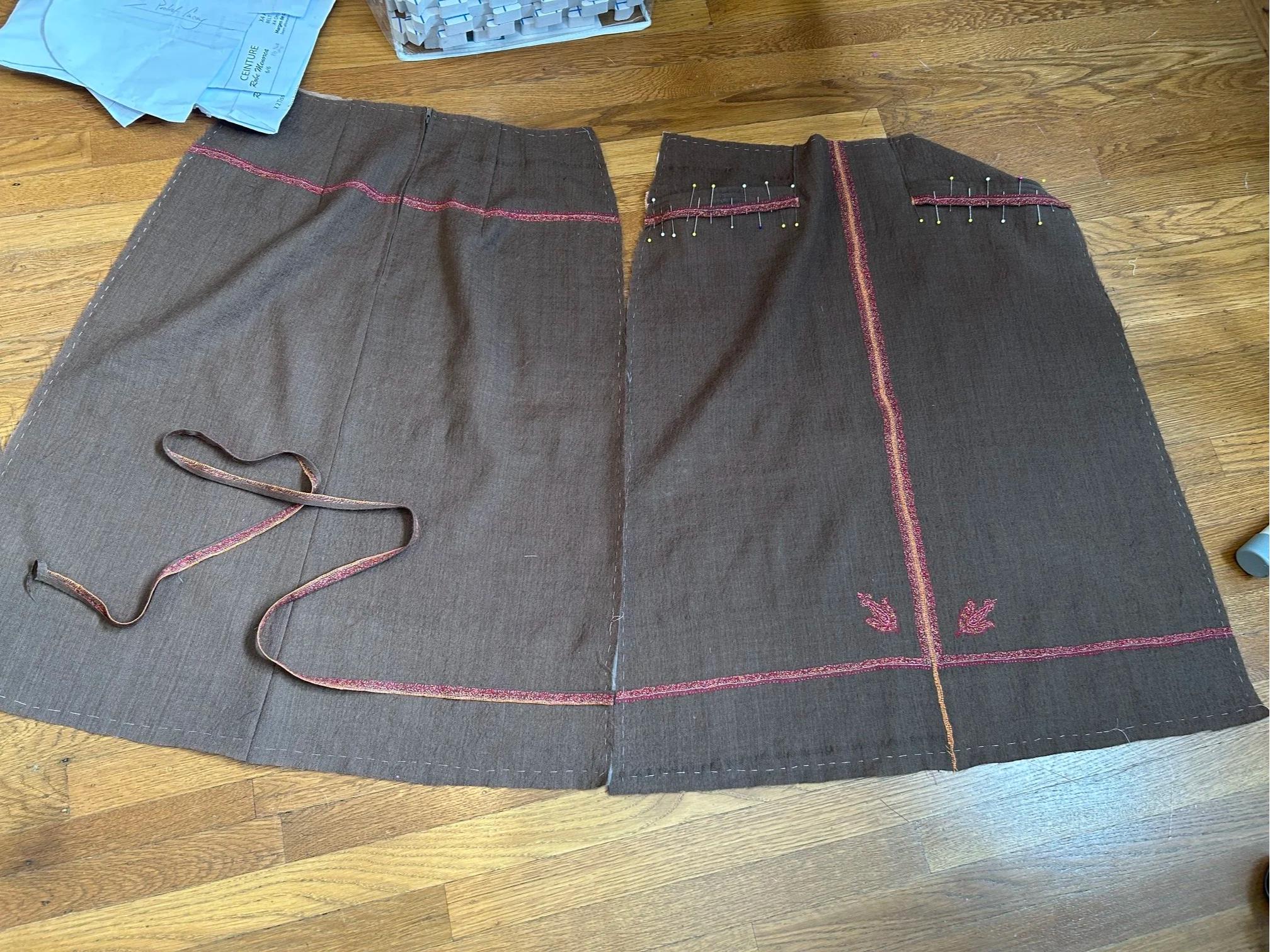 matching the appliqued embroidery to the front on the skirt pieces