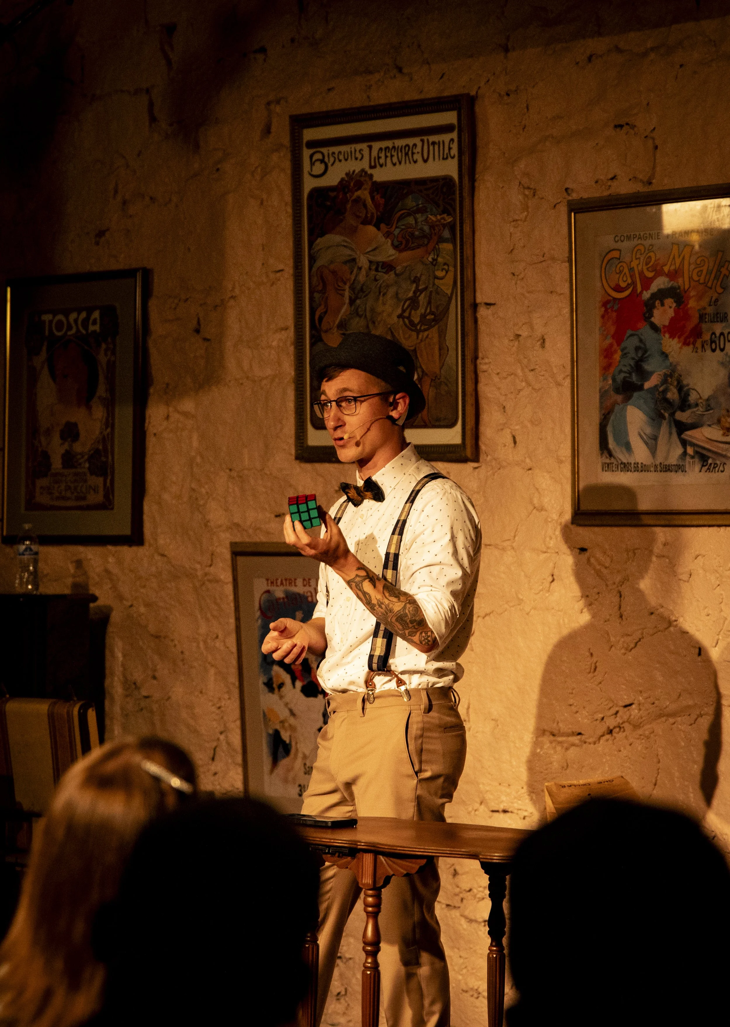 Patrick the Magician performing a mind-blowing Rubik's Cube magic routine for an audience of adults in Atlanta.