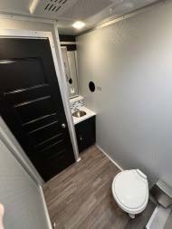 Interior of luxury restroom trailer with private door