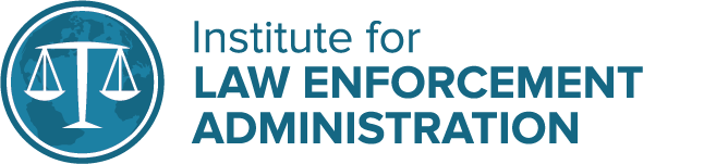 Logo of the Institute for Law Enforcement Administration featuring a blue circle with a white scale of justice inside.