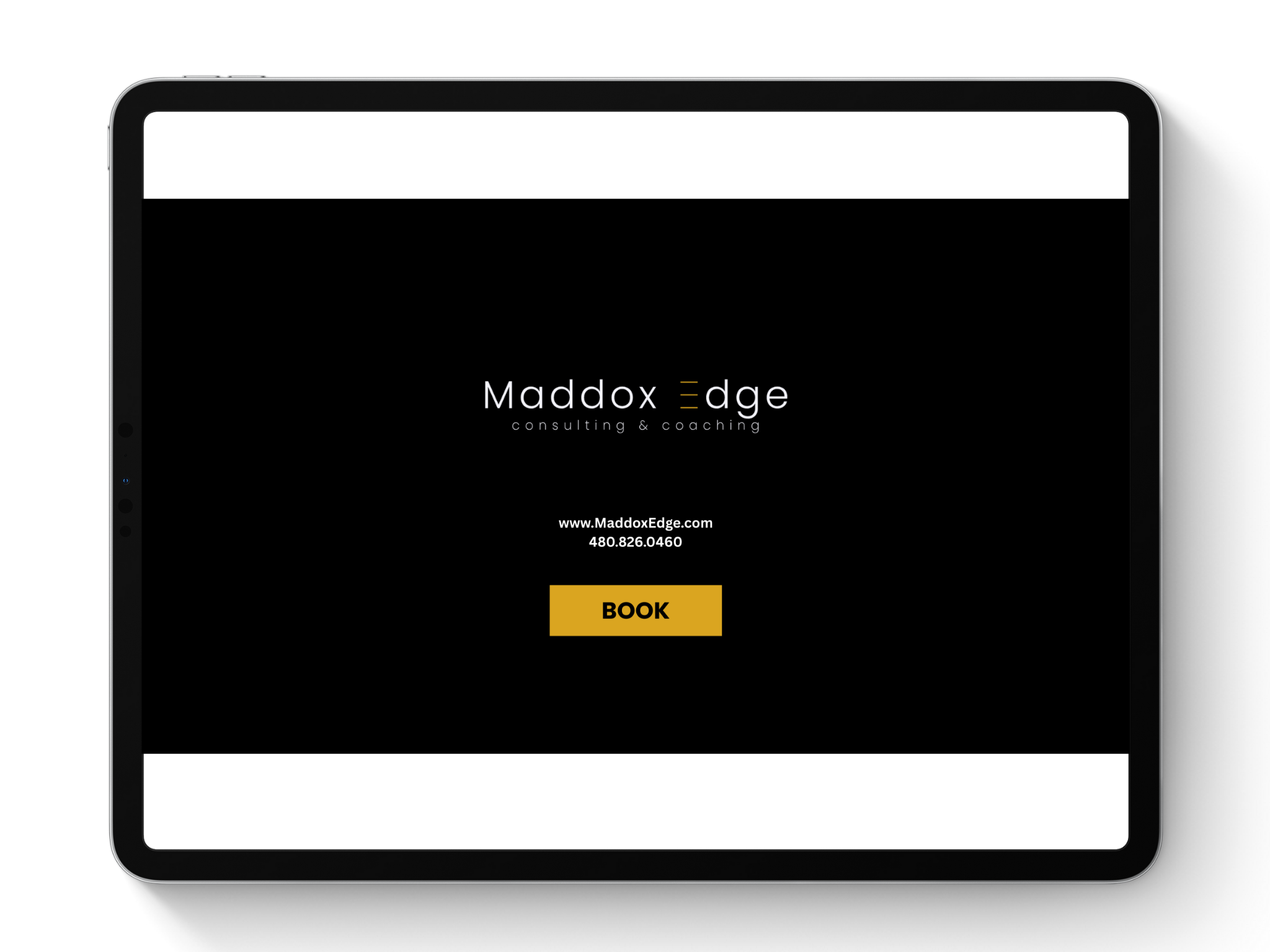 iPad displaying Maddox Edge coaching service website with a black background, white text, and a yellow 'Book' button.