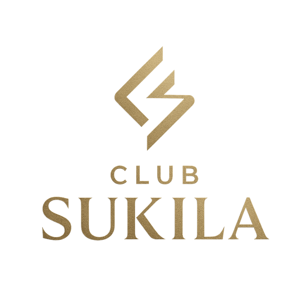 Gold sign with a logo and the text 'Club Sukila' on a wall.