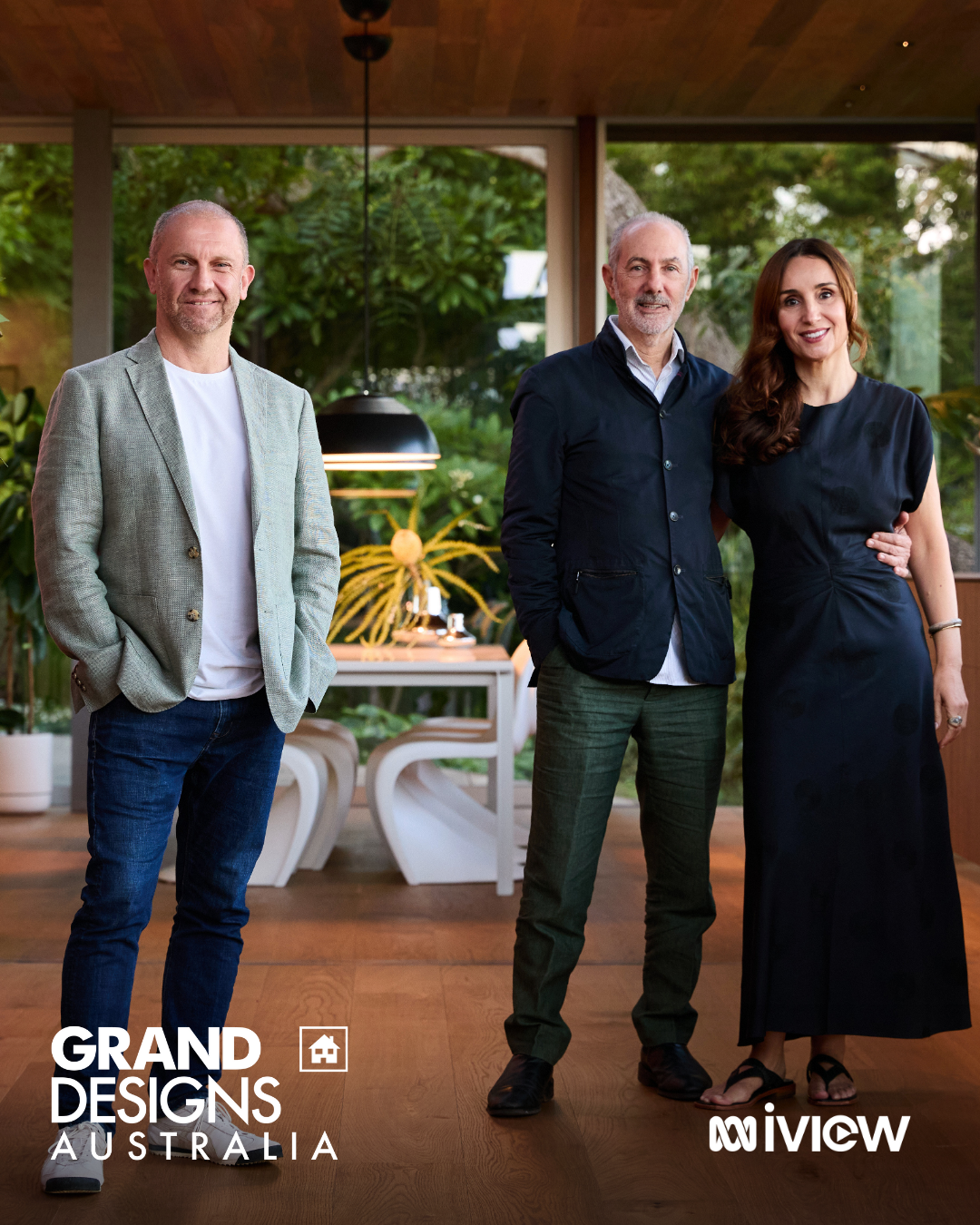 Still from Grand Designs Australia featuring host Anthony Burke with Ed Lippmann and Sonya, inside the Rose Bay home overlooking the rear garden.