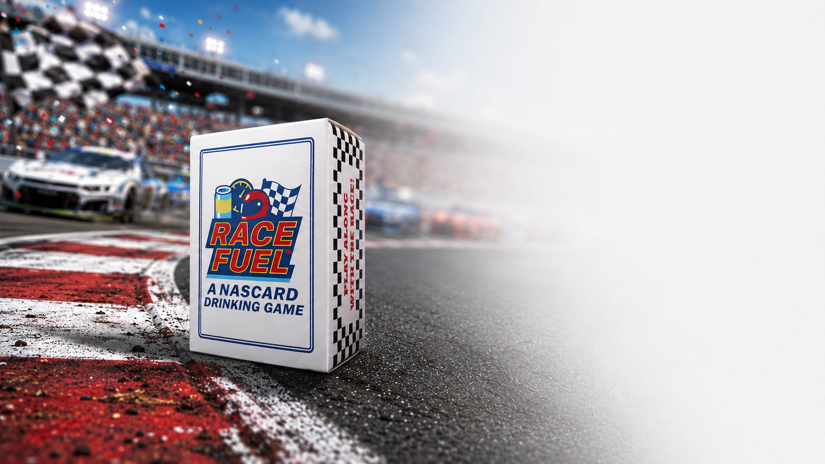 A box of Race Fuel, a Nascar drinking game, is placed on a racetrack with race cars and a crowd in the background, partially obscured by fog or smoke.