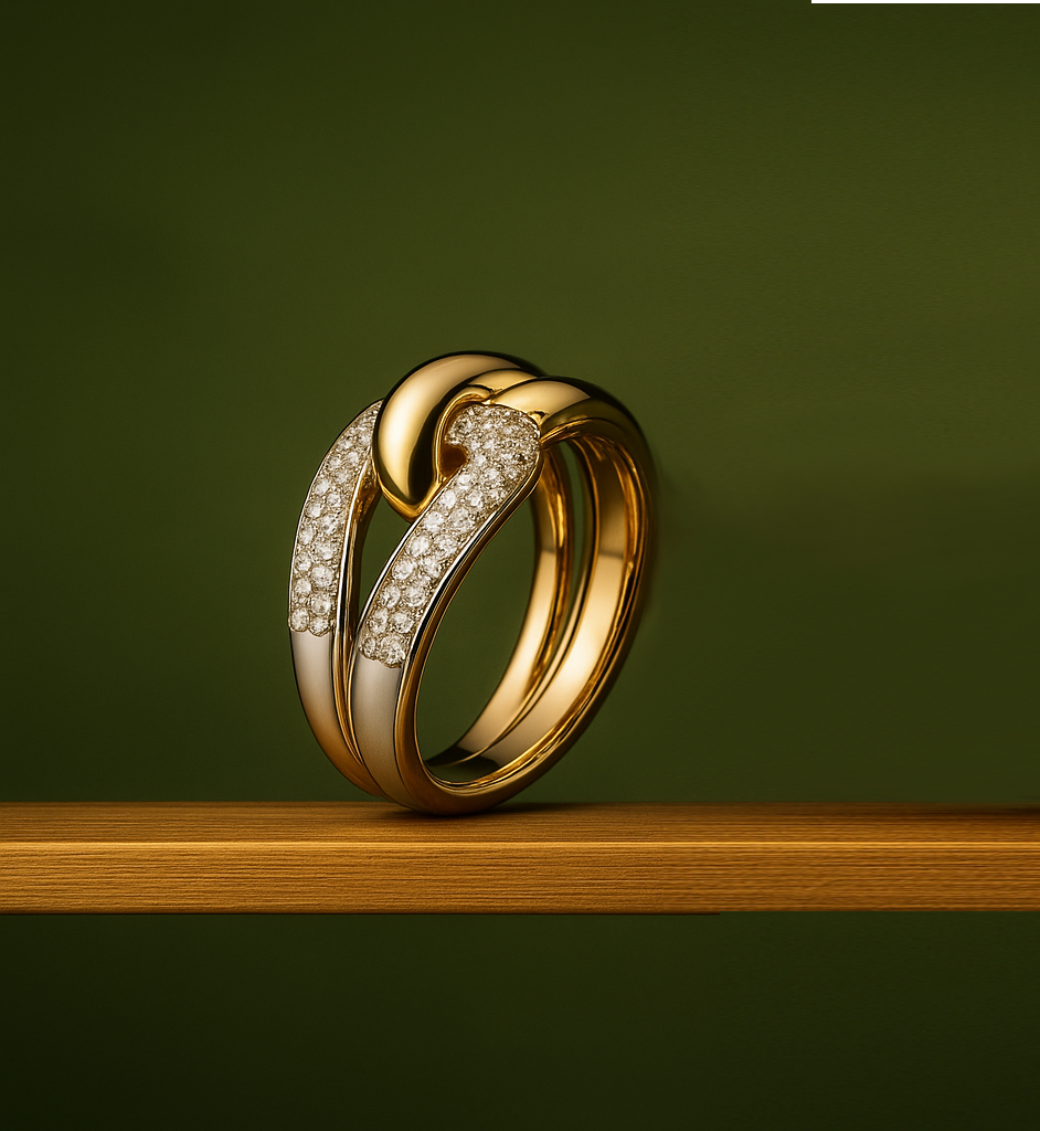 Ti Sento Gold and diamond ring jewelry displayed on a wooden shelf against a green background.