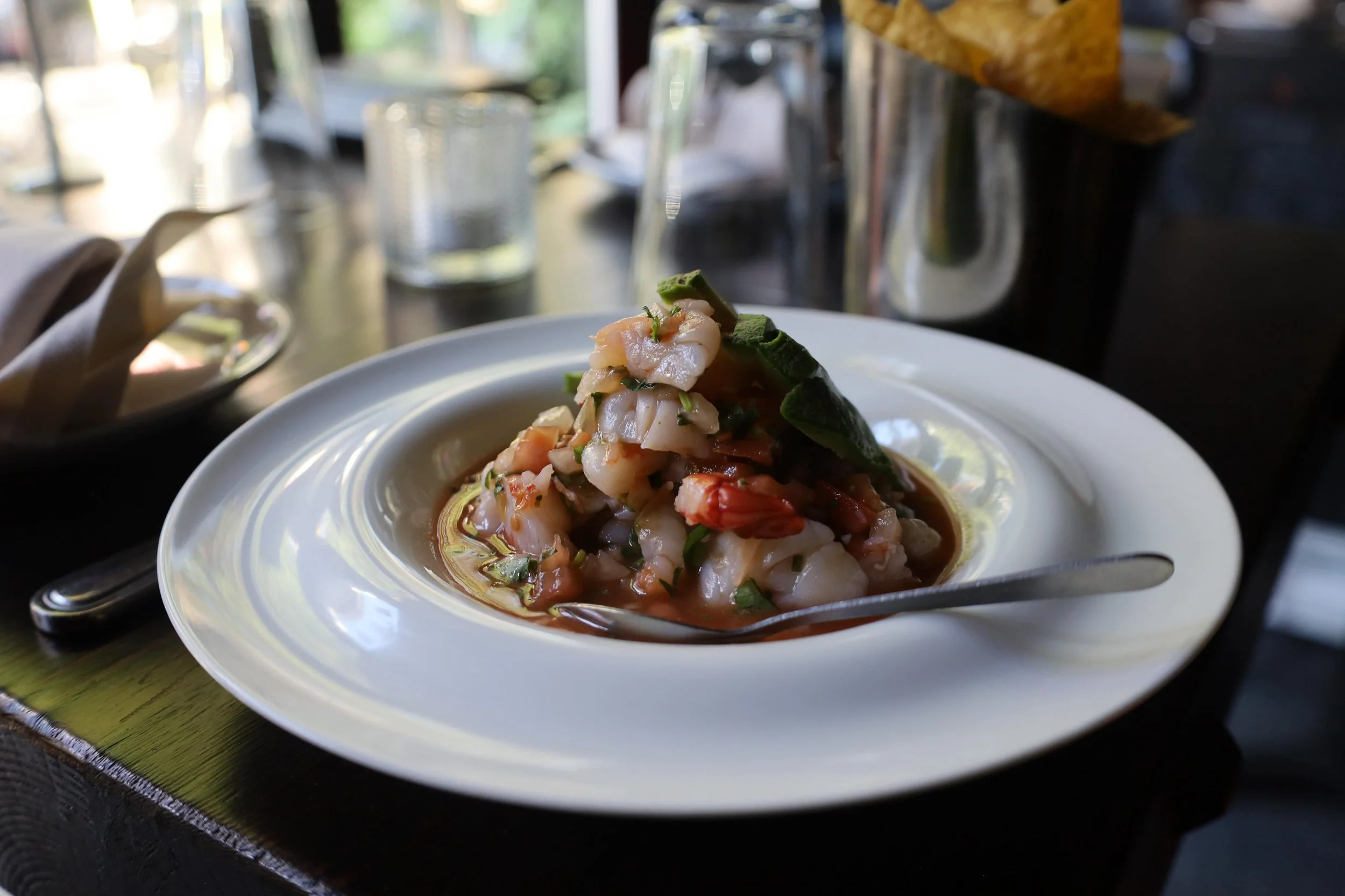 ECUADORIAN Ceviche!!
Step into Guayaquil with a vibrant, cold seafood &ldquo;soup&rdquo; featuring cooked shrimp or octopus marinated in a bright citrus, tomato, and cilantro broth. Unlike other styles, it is slurped with a spoon and always served wi