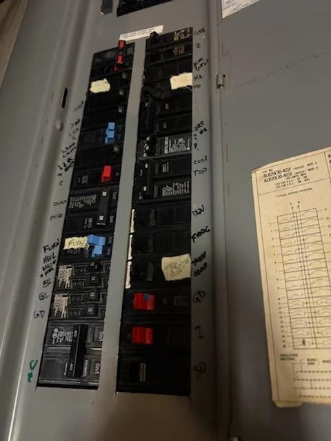 Completed panel wiring for a residential condenser circuit installed by Innis Electric in Natick, MA on September 11, 2026.
