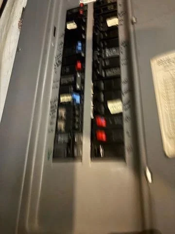 Breaker panel work for a new condenser circuit installation in Natick, MA on September 11, 2026.