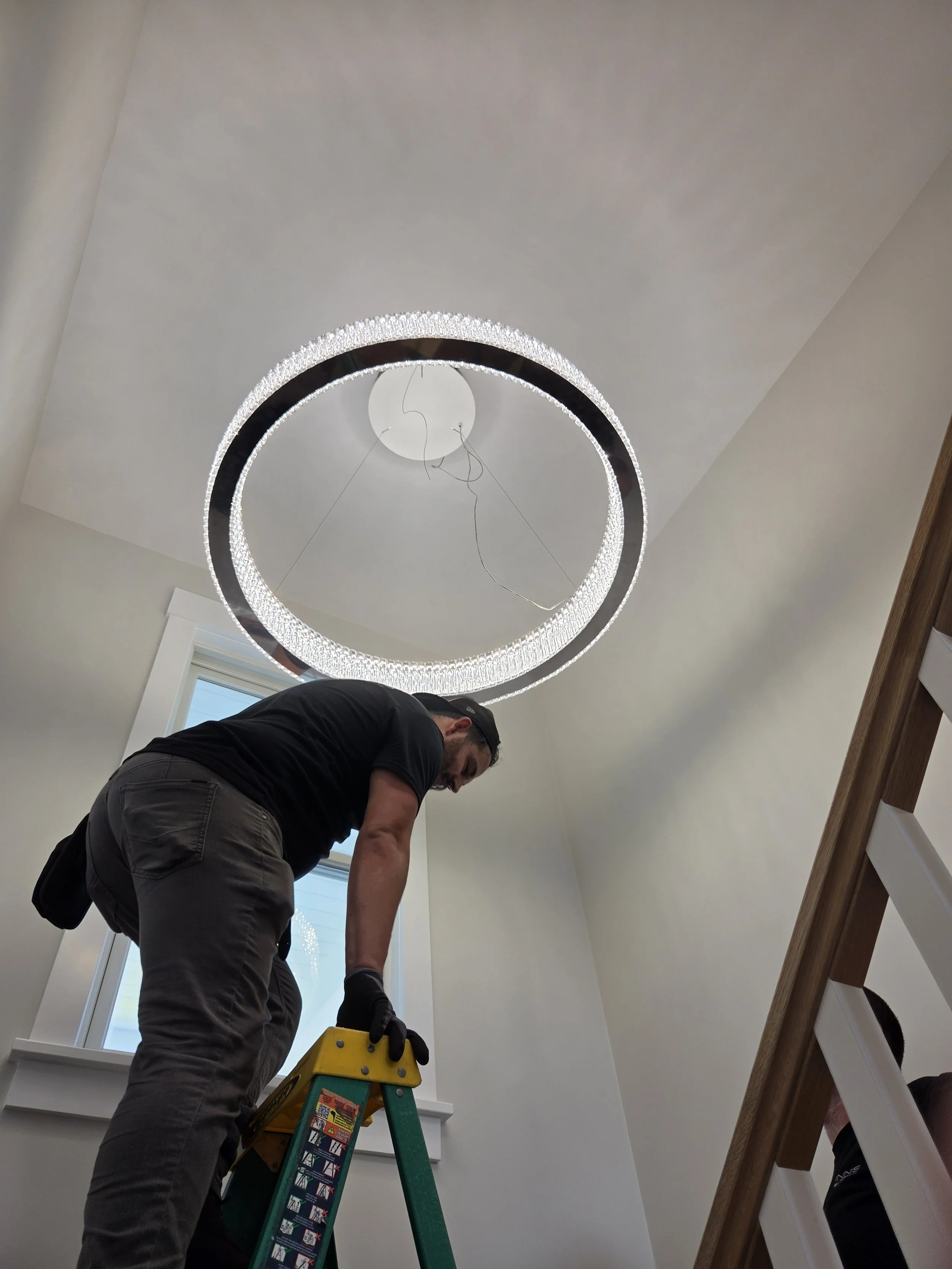 08-chandelier-installation-stairwell.jpg