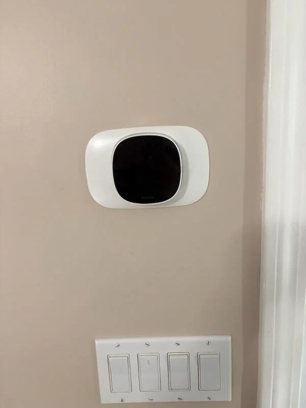 Finished indoor thermostat and switch area for a Natick, MA condenser circuit installation by Innis Electric on September 11, 2026.