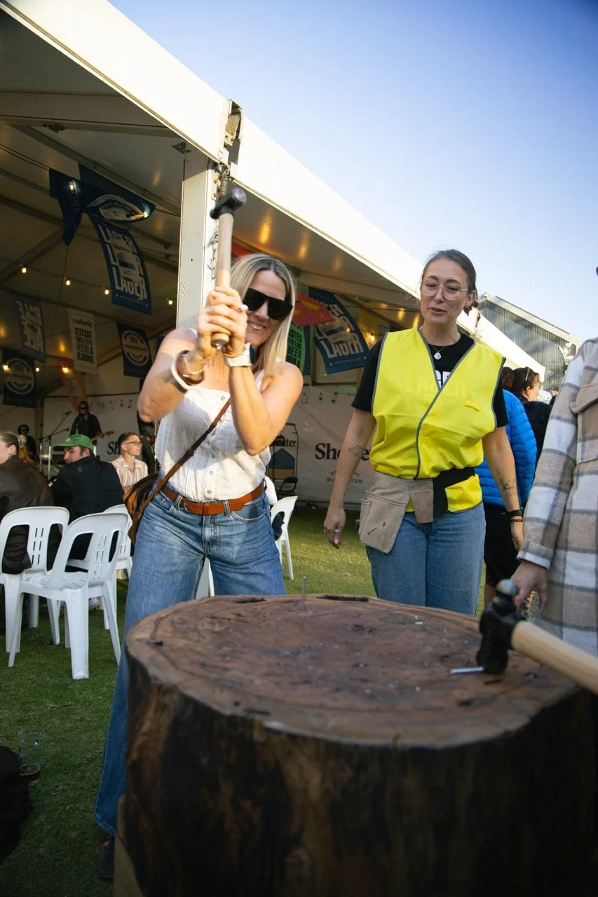 Woman play a game at BEERHALL 2025 on the Busselton Foreshore