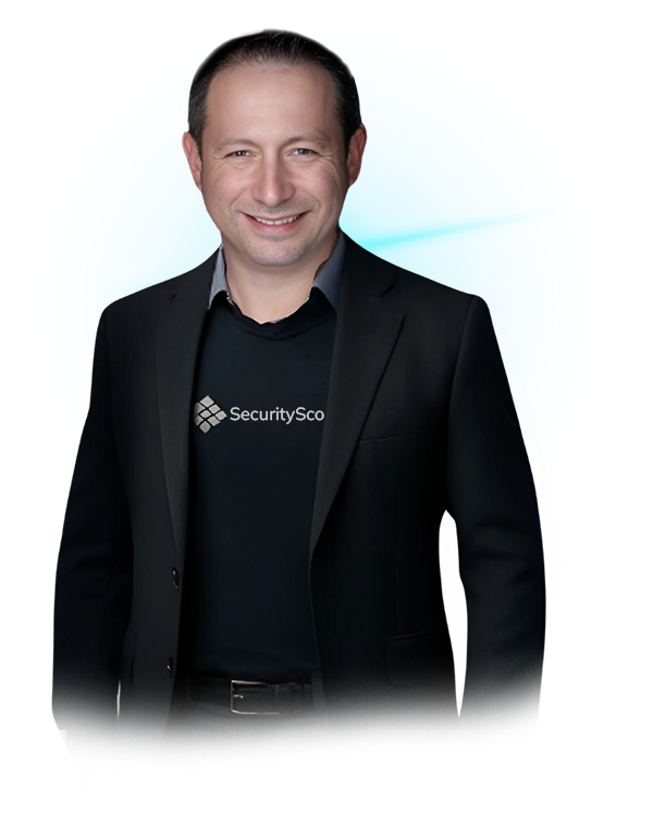 Dr. Aleksandr Yampolskiy | Cybersecurity Expert & CEO of SecurityScorecard in black suit and SecurityScore T-shirt smiling in front of a blue circular digital background.