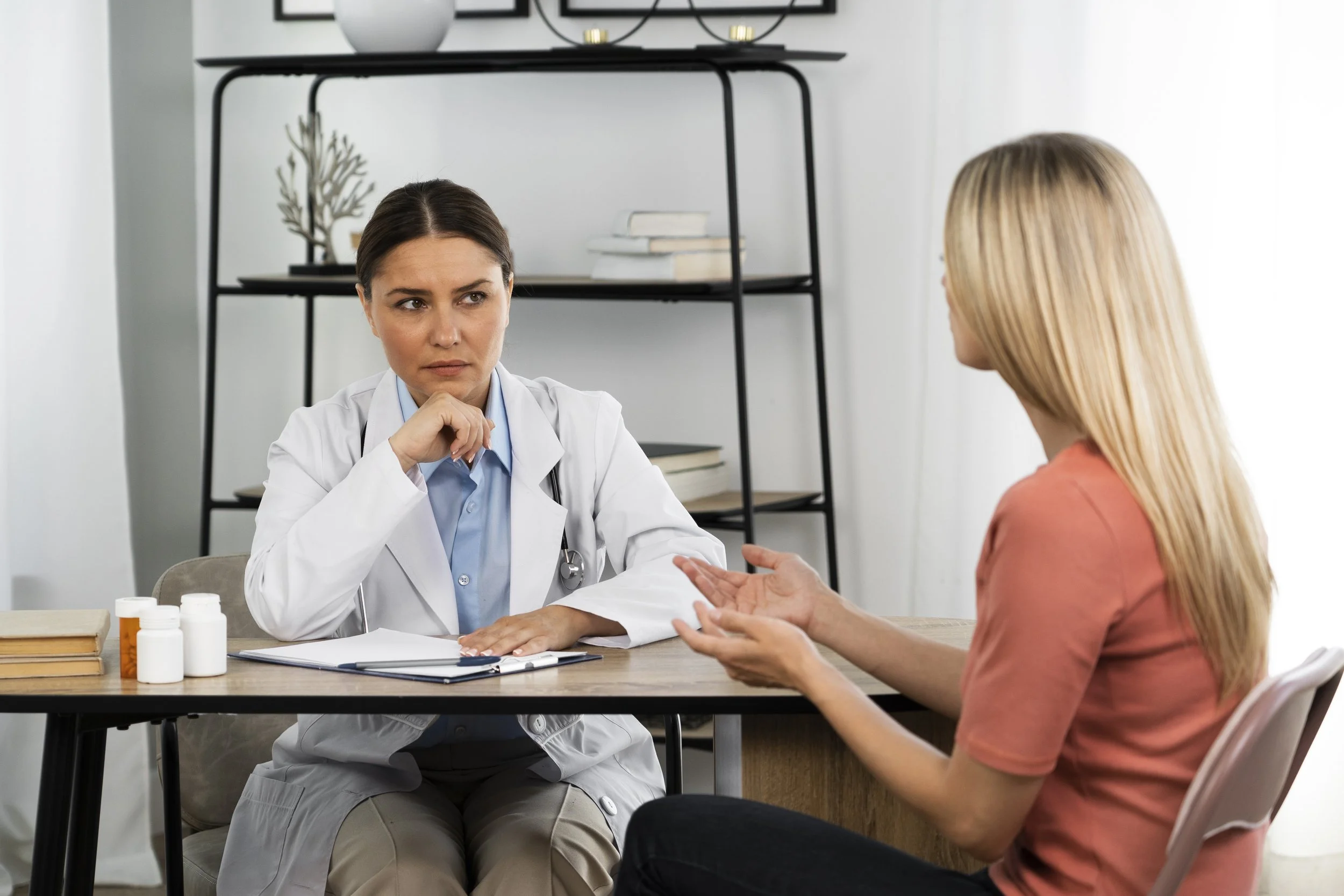 Psychiatrist listening attentively to a patient during a consultation