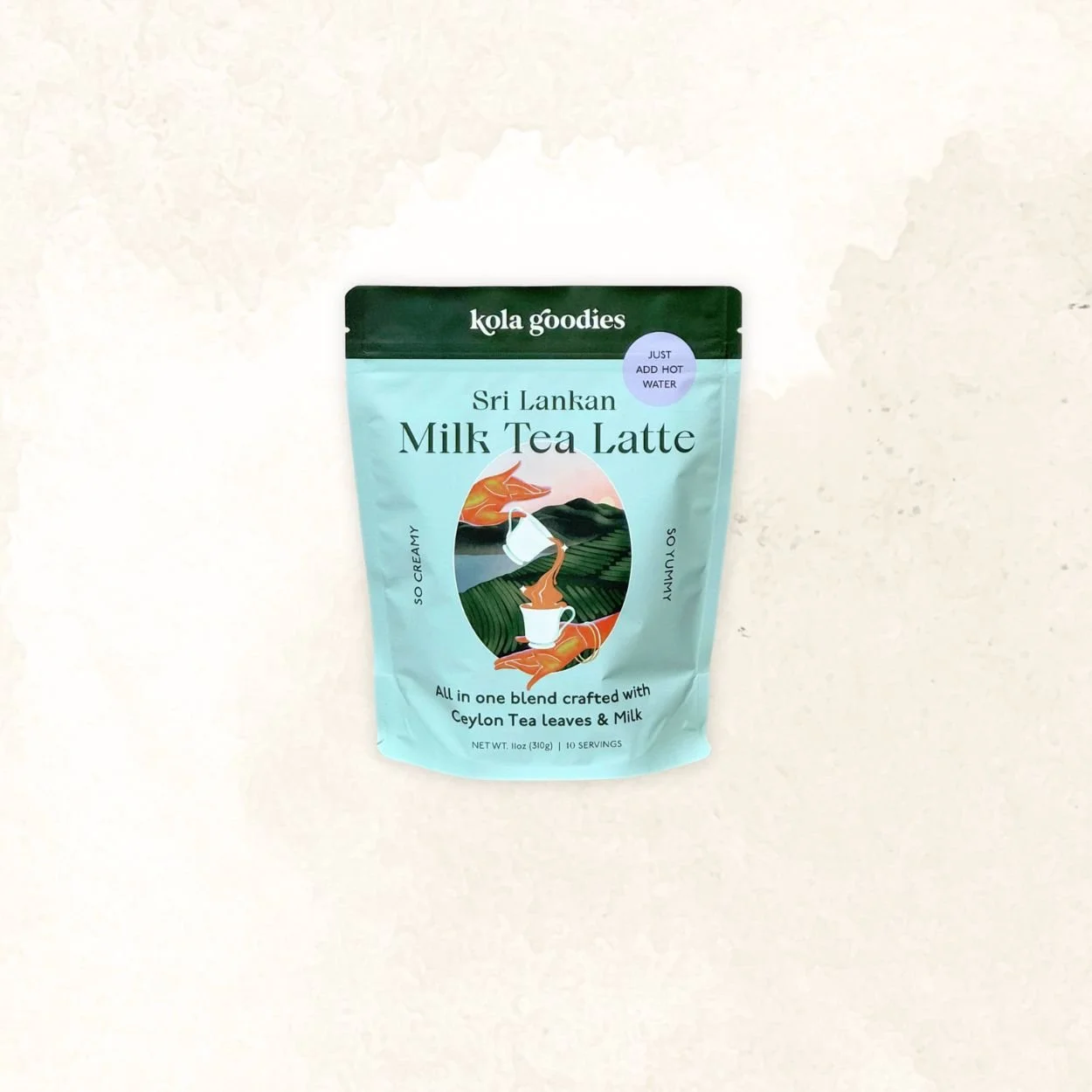 Package of Kola Goodies Sri Lankan Milk Tea Latte with an illustration of a tea cup, tea leaves, and a mountain landscape.