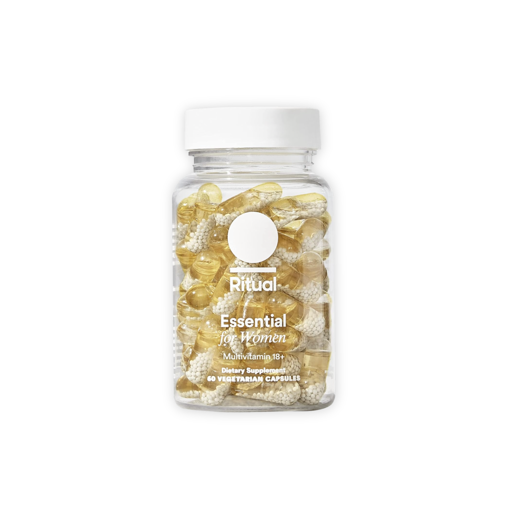 Bottle of Ritual Essential multivitamin capsules for women with clear capsules containing white beads, on a black background.