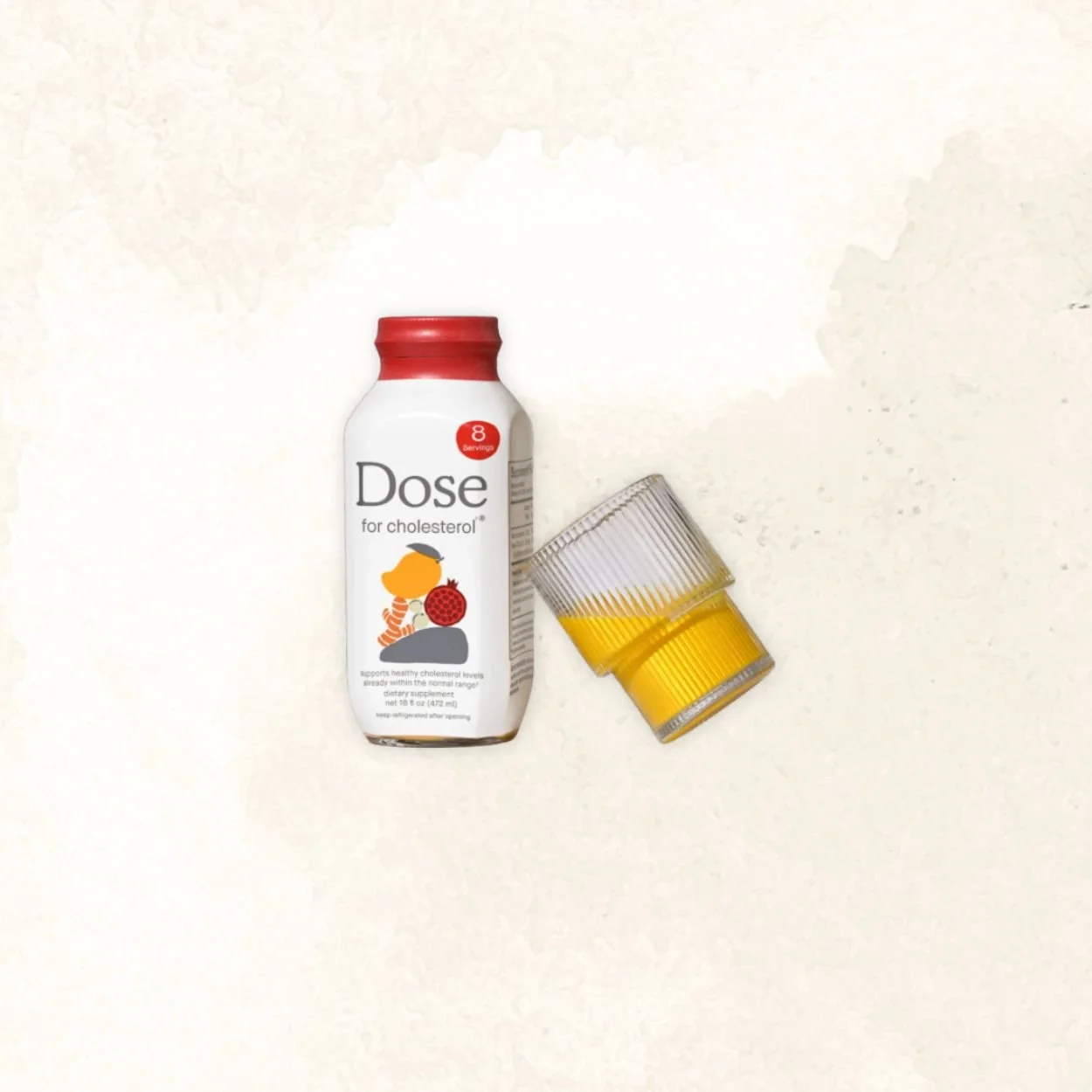 A white bottle labeled Dose for cholesterol with a red cap and an illustration of a person with an orange hair holding a large red orb, next to a glass of yellow liquid