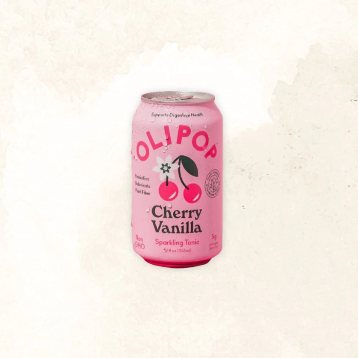 A pink can of Olipop cherry vanilla sparkling tonic with illustrations of cherries and a flower, featuring text about its health benefits and flavor.
