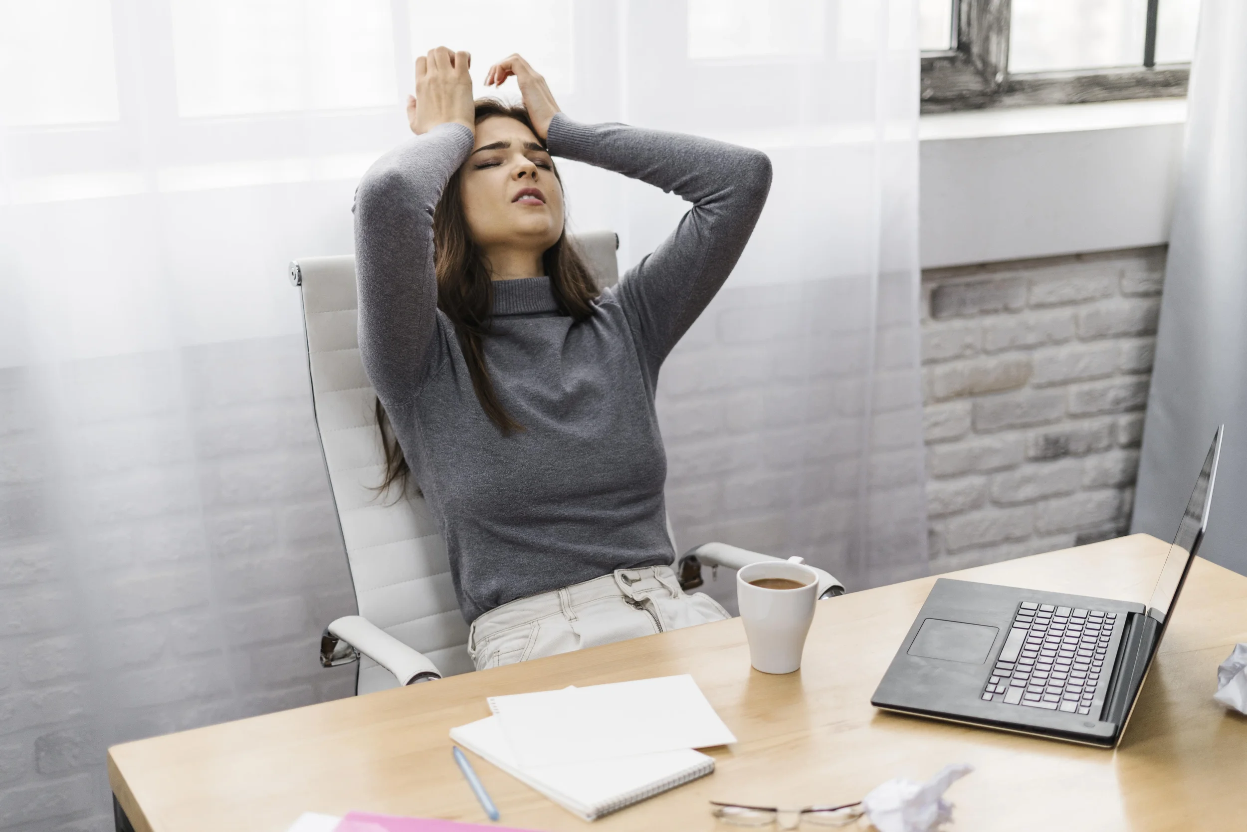 A woman experiencing chronic stress - Integrative Healthcare Alliance