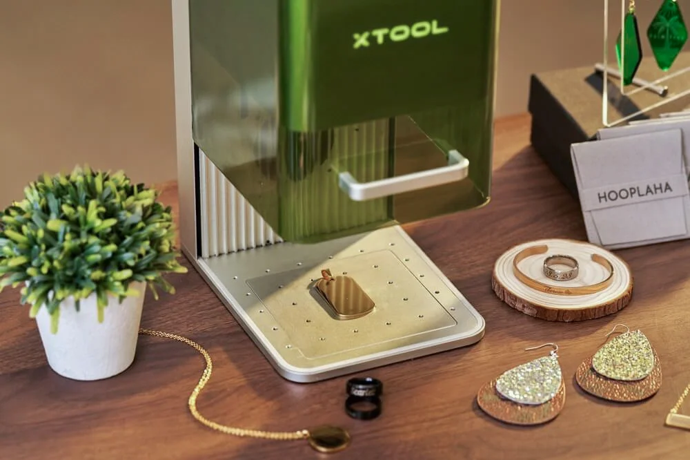 Professional live laser engraving service at corporate brand activation event