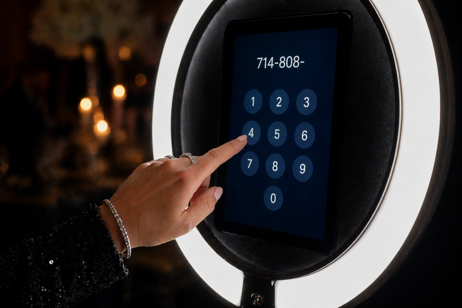 Guest entering phone number on roaming photo booth screen to receive photo via text at a Southern California event