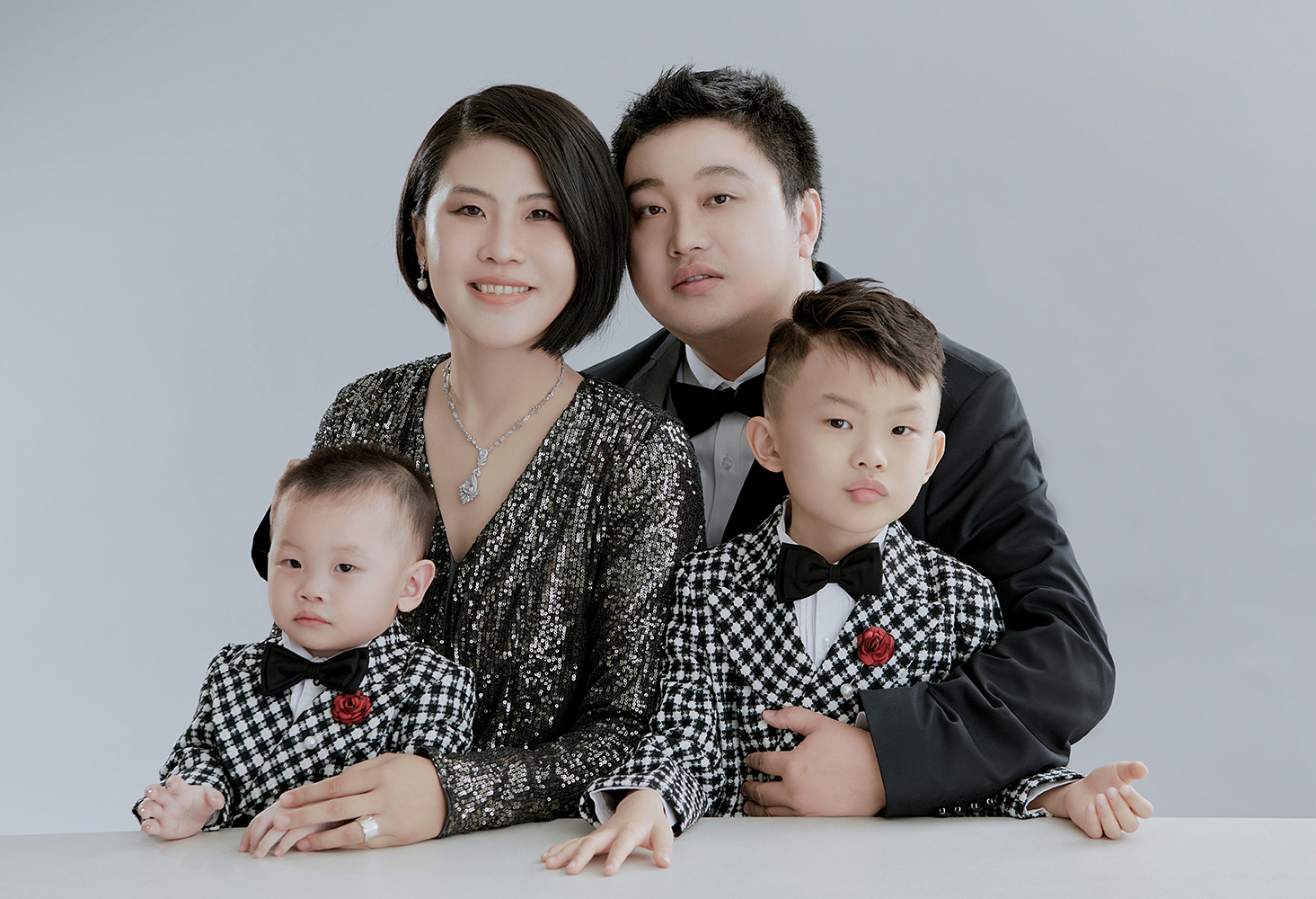 Elegant family portrait with newborn baby in Flushing studio