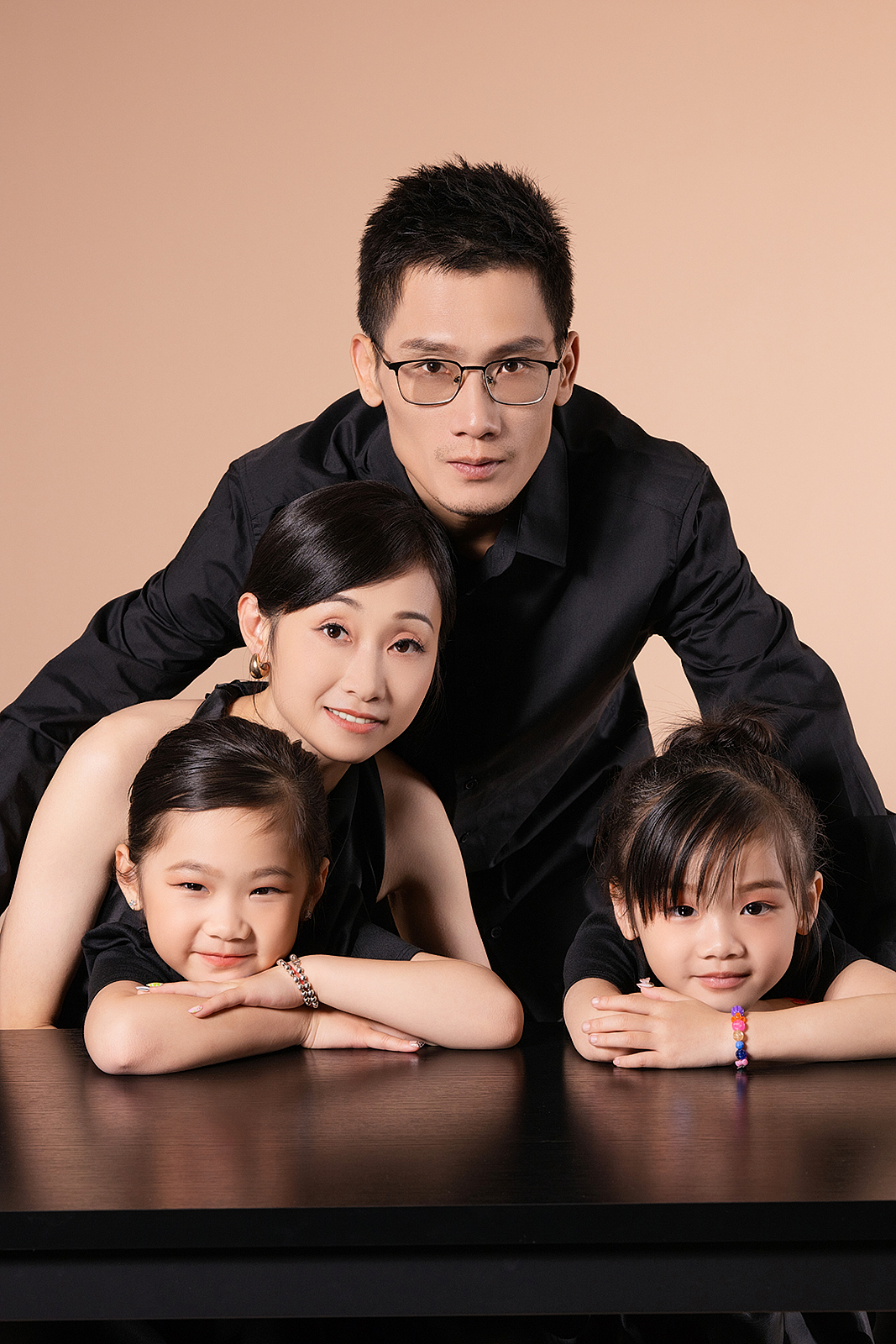 Multi-generational family portrait in elegant NYC studio setting
