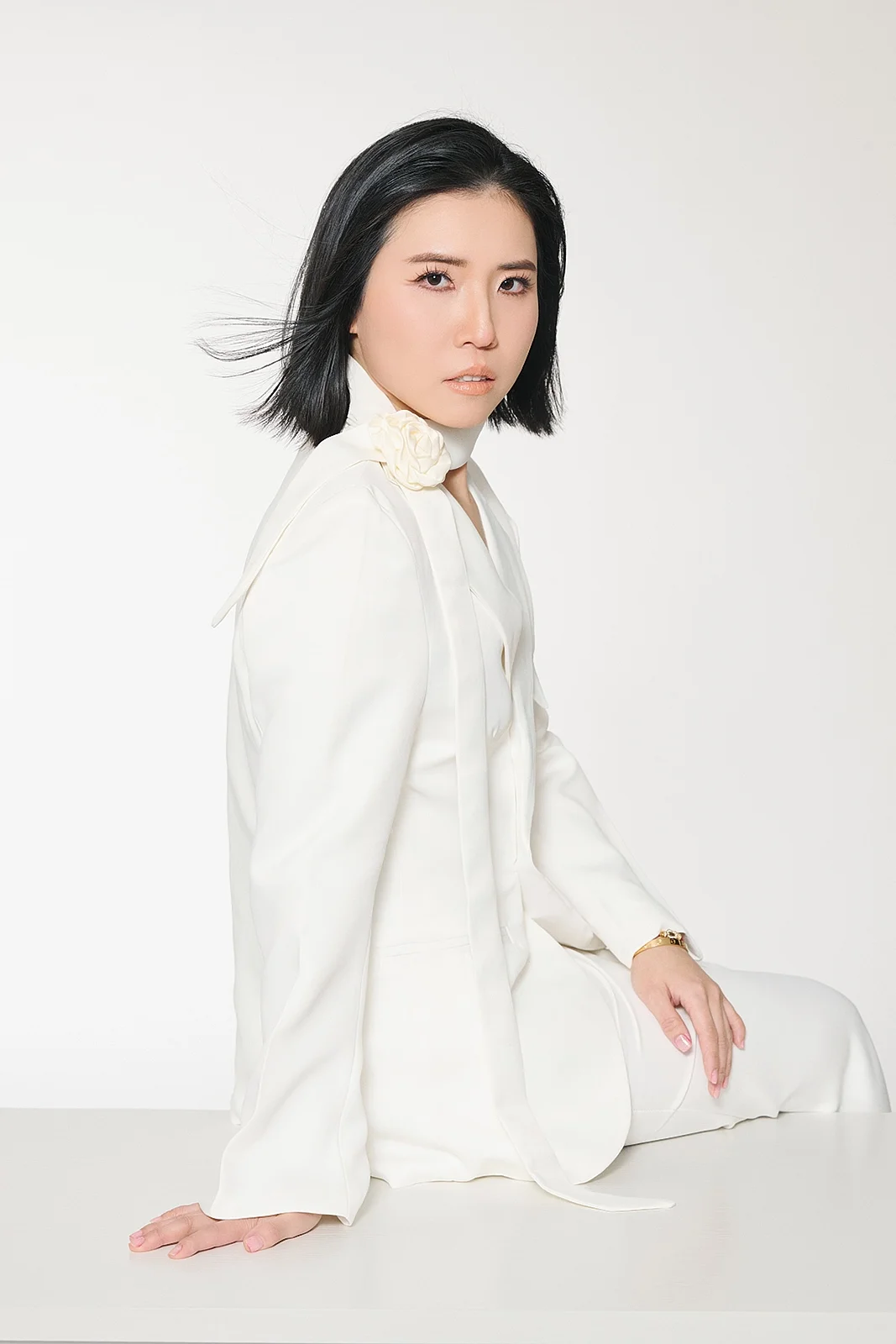 Editorial-style portrait with soft pastel backdrop in Manhattan, NYC