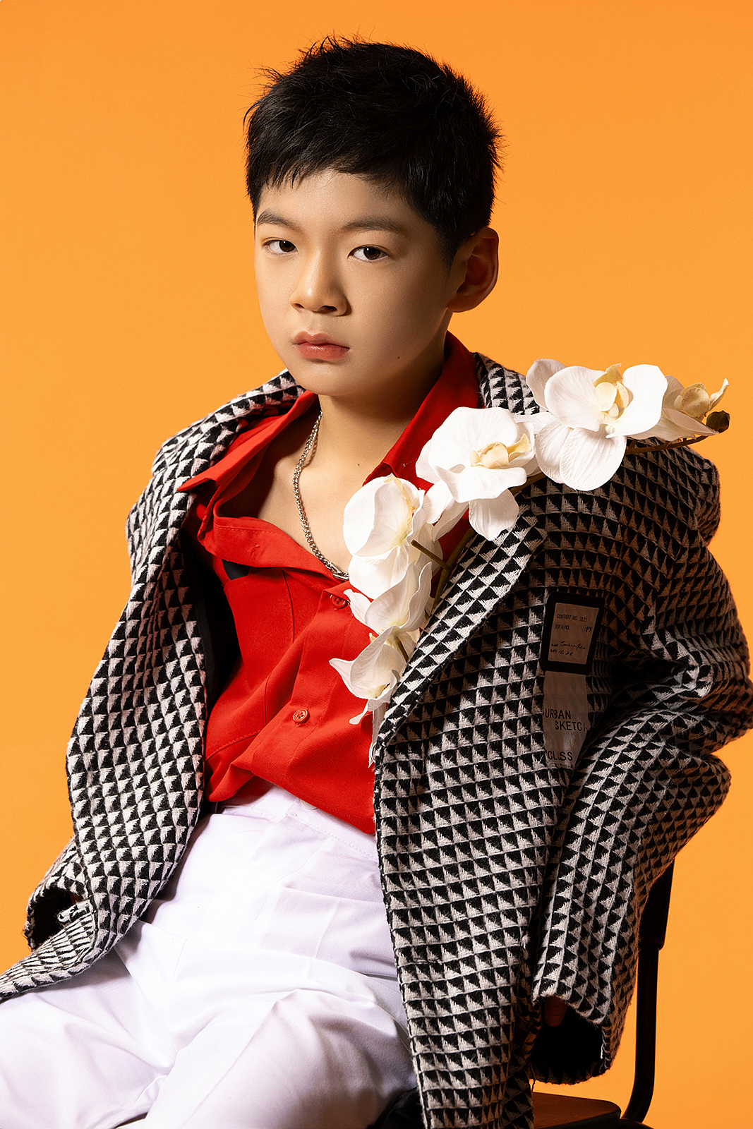 Boy in formal vest and tie for editorial children’s portrait in NYC