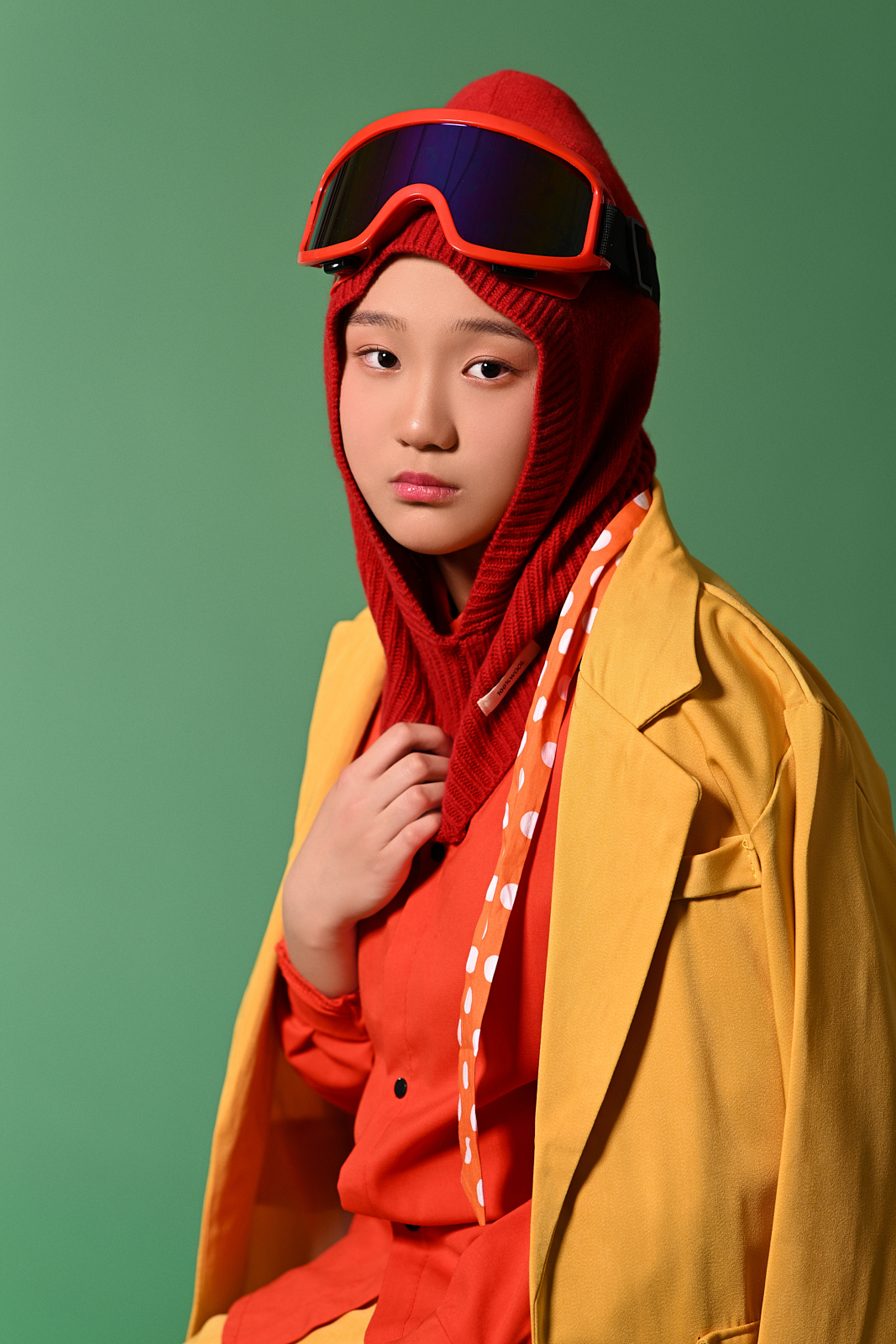 Smiling girl holding teddy bear in high-end studio photoshoot in Queens