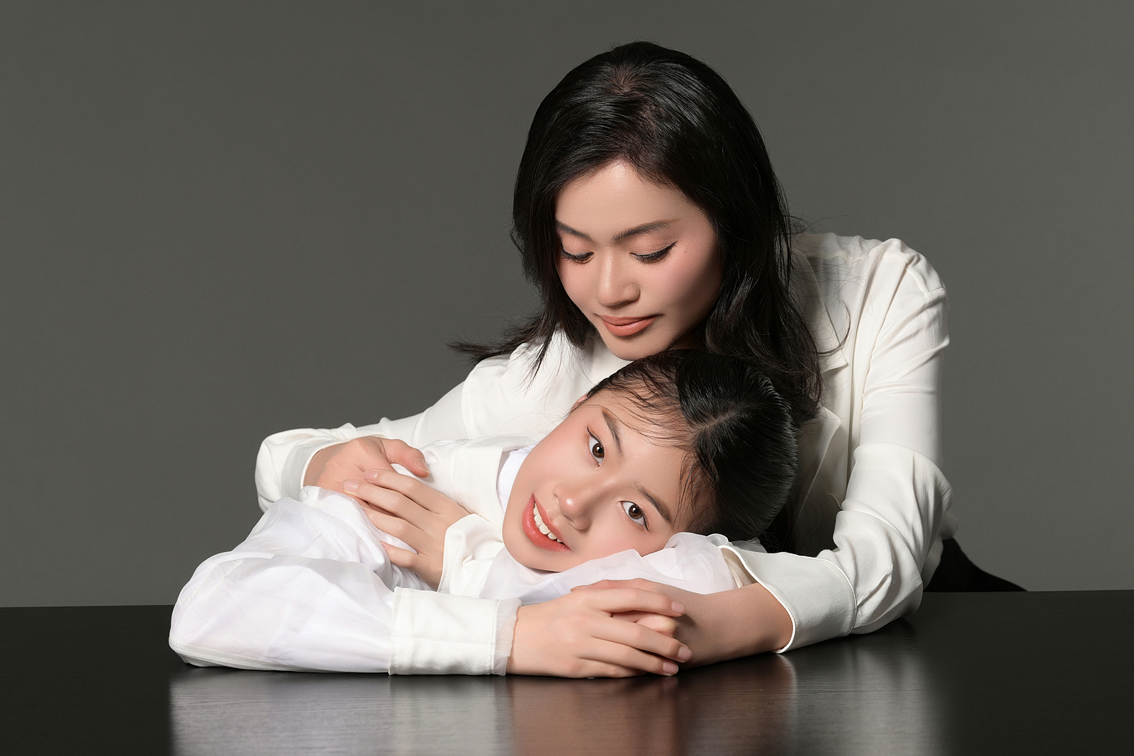 High-end black-and-white family portrait in NYC photography studio