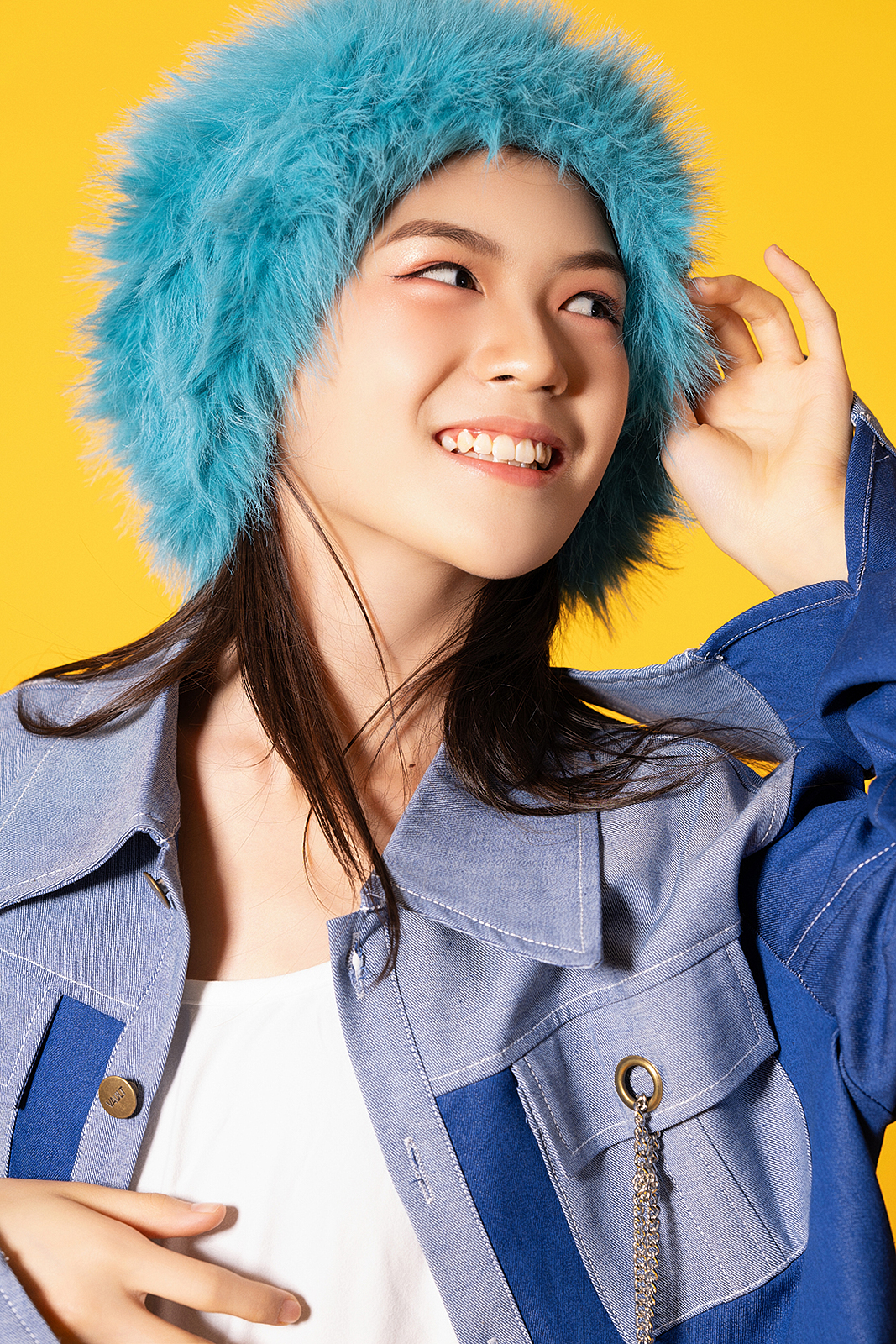 Smiling girl in pastel dress during studio photoshoot in Flushing