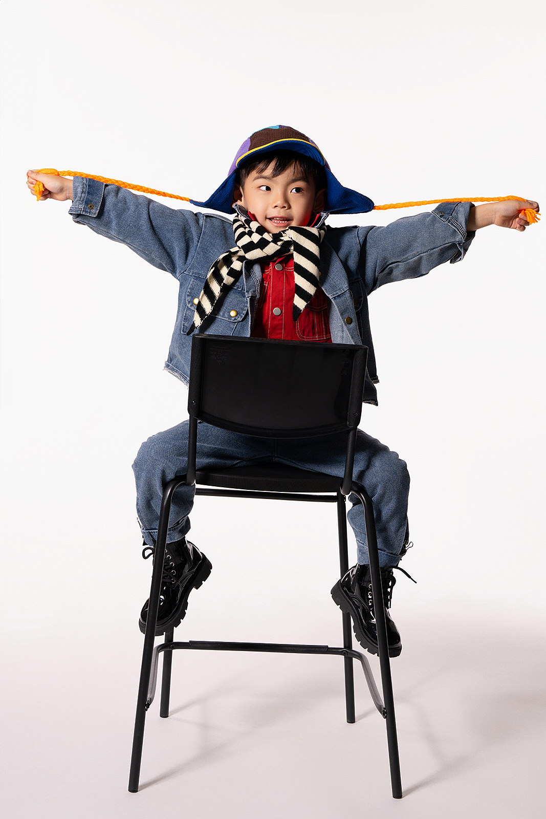 Natural sunlight children’s portrait by window in Flushing photography studio