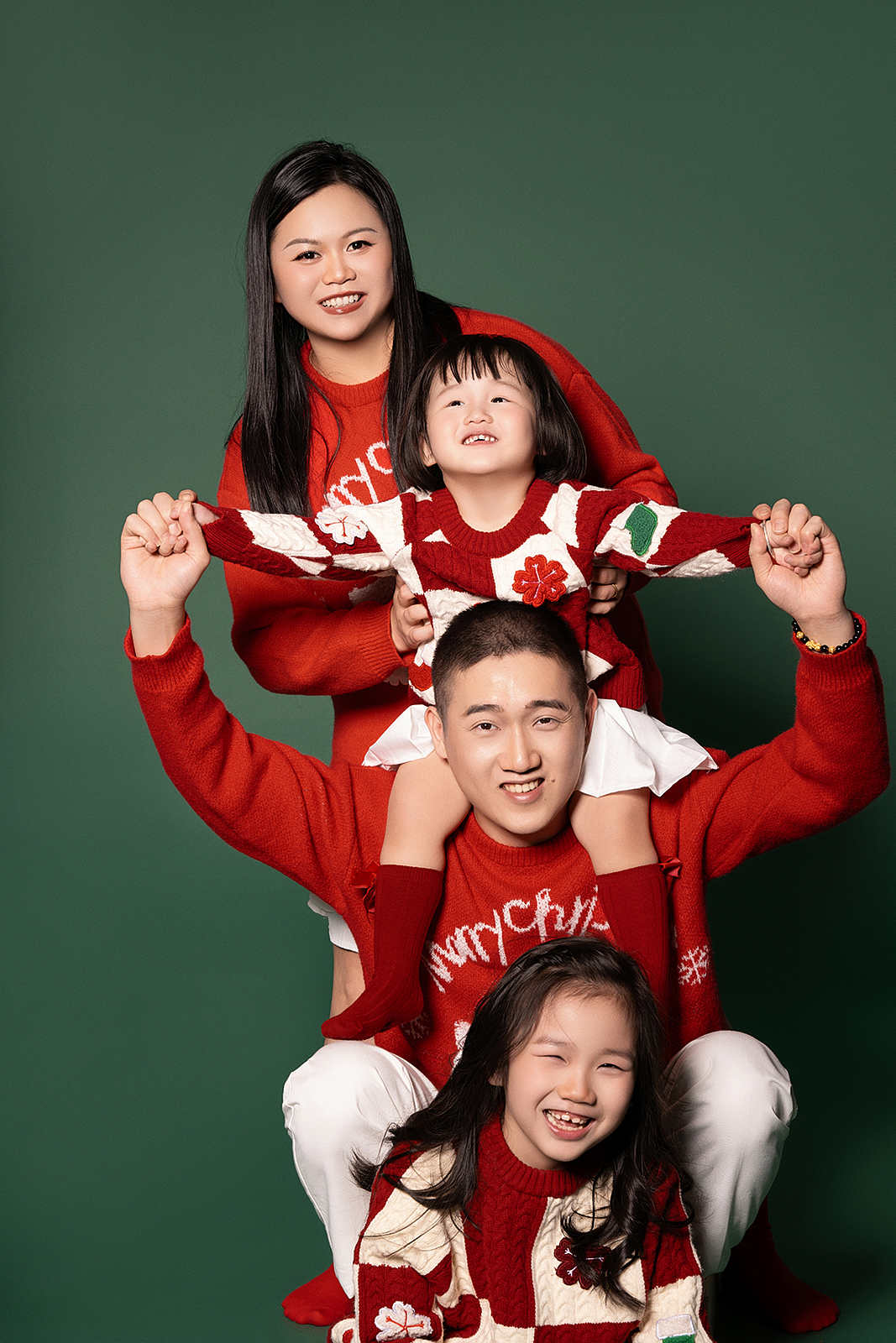 Family portrait in studio with floral backdrop, Flushing, NYC