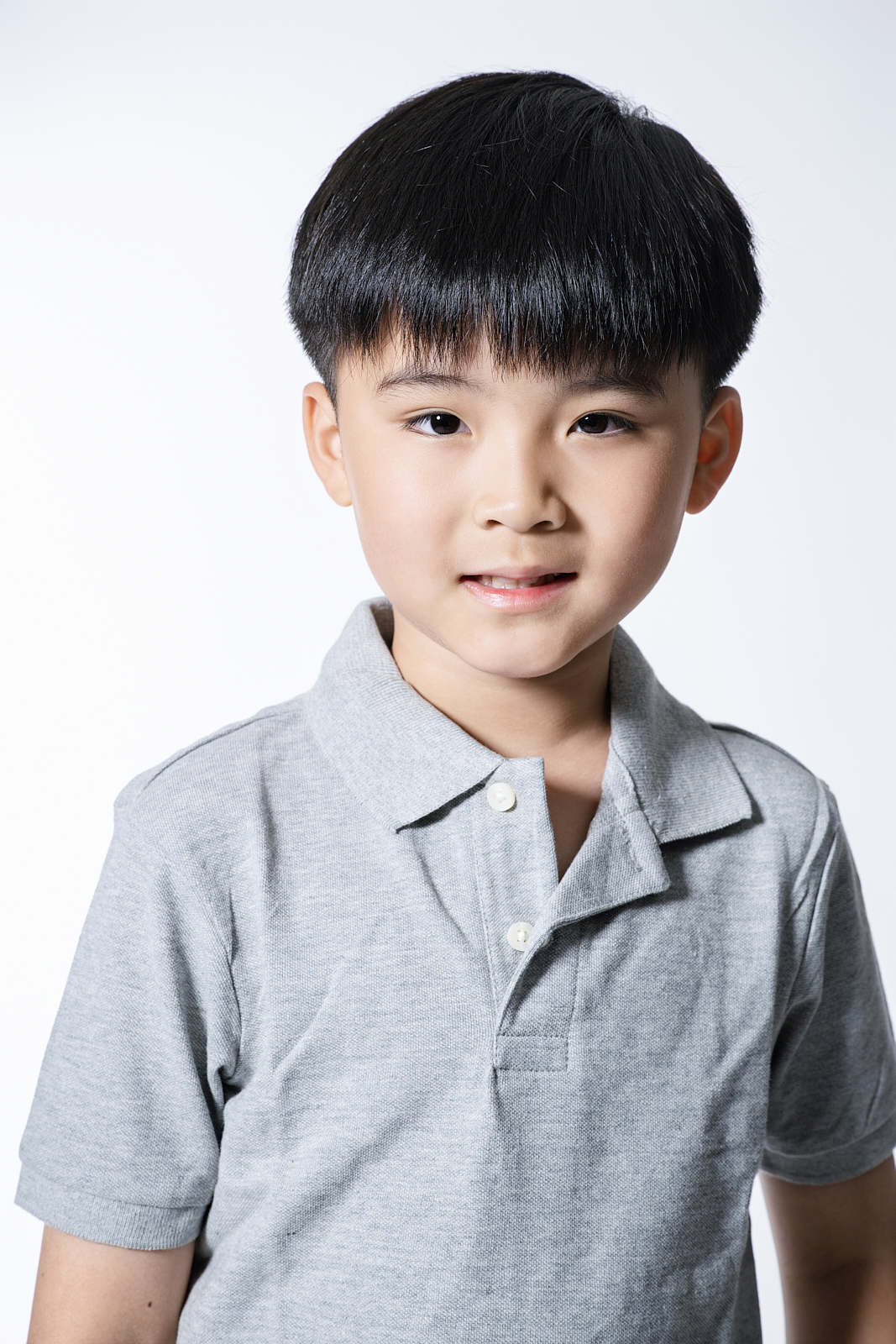NYC comp card update - child model on white backdrop