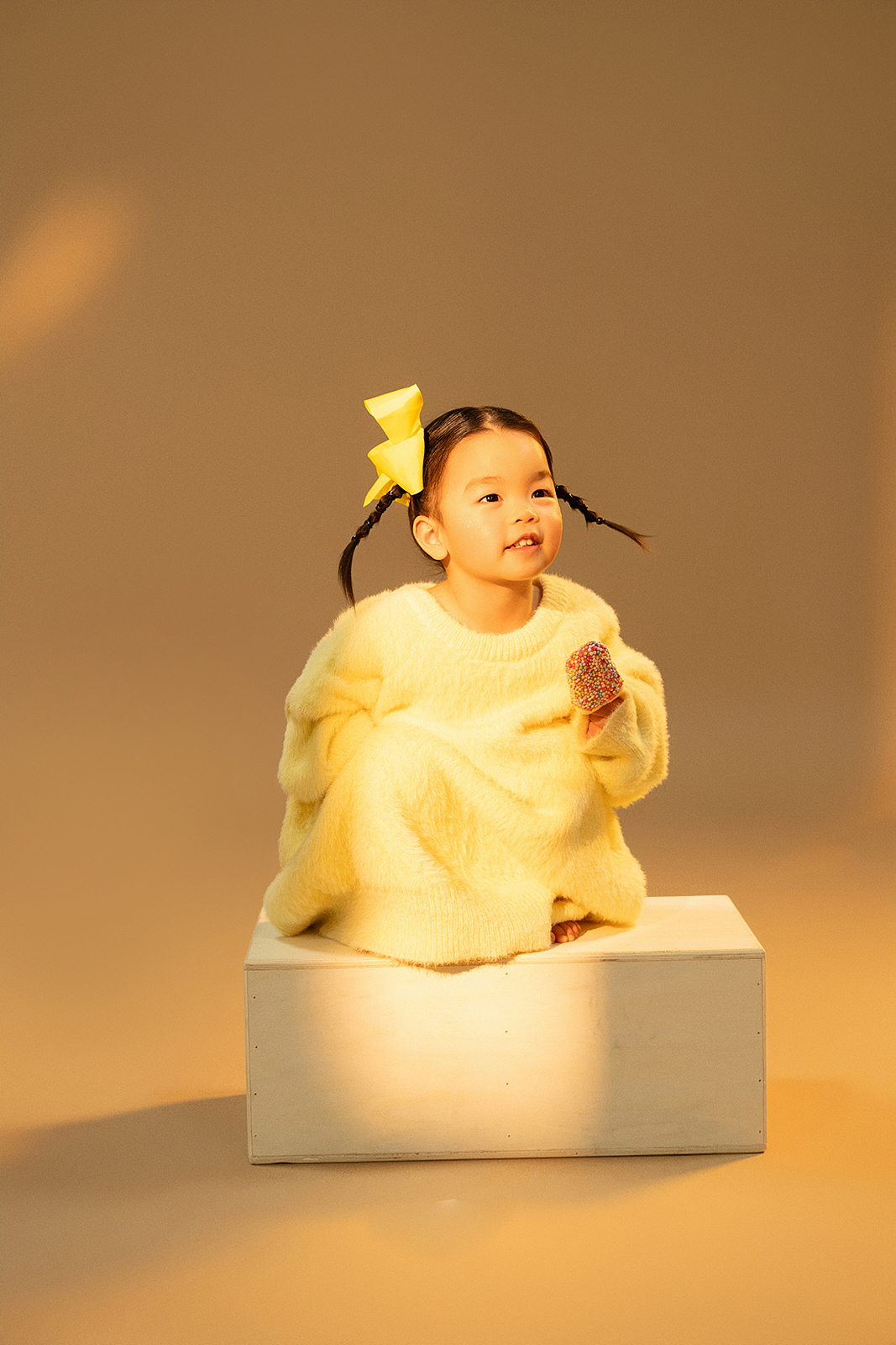 Girl in lace dress for editorial-style children’s photo in Queens, New York