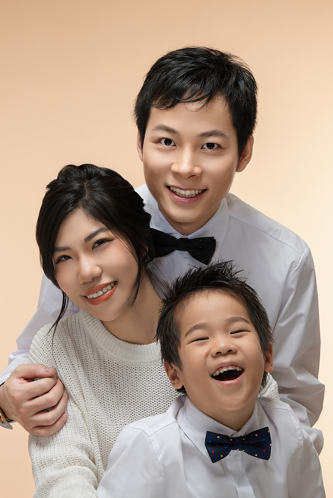 Family portrait with young children in cozy NYC studio setting