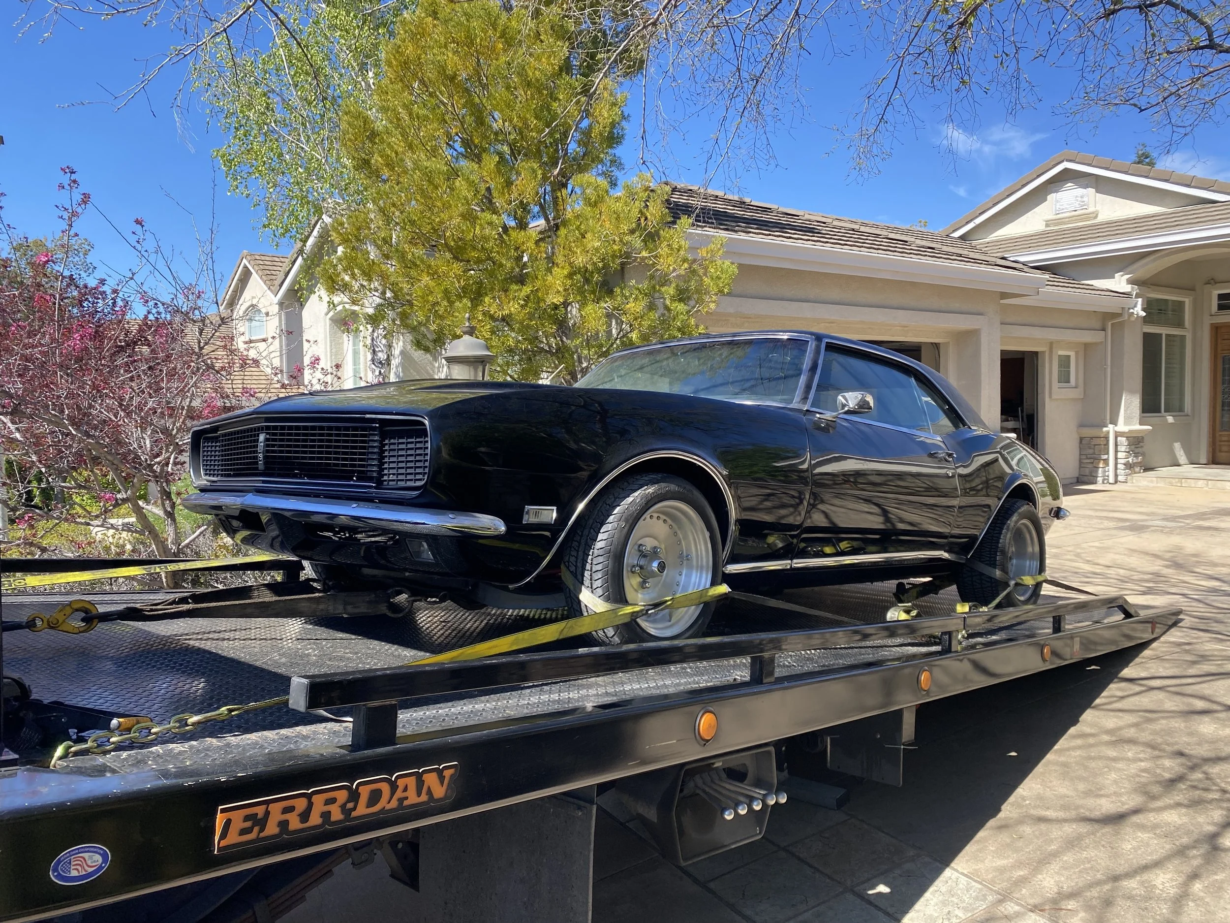 Classic Chevrolet Camaro transported on a flatbed tow truck by 24-7 Rescue Towing in Antioch CA.