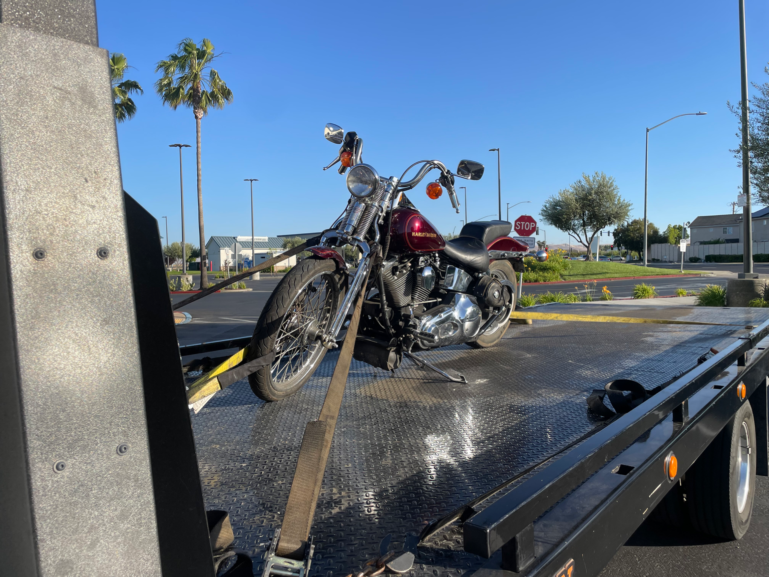 24-7 Rescue Towing transporting a Harley Davidson motorcycle near the Discovery Bay Post Office in Discovery Bay, California