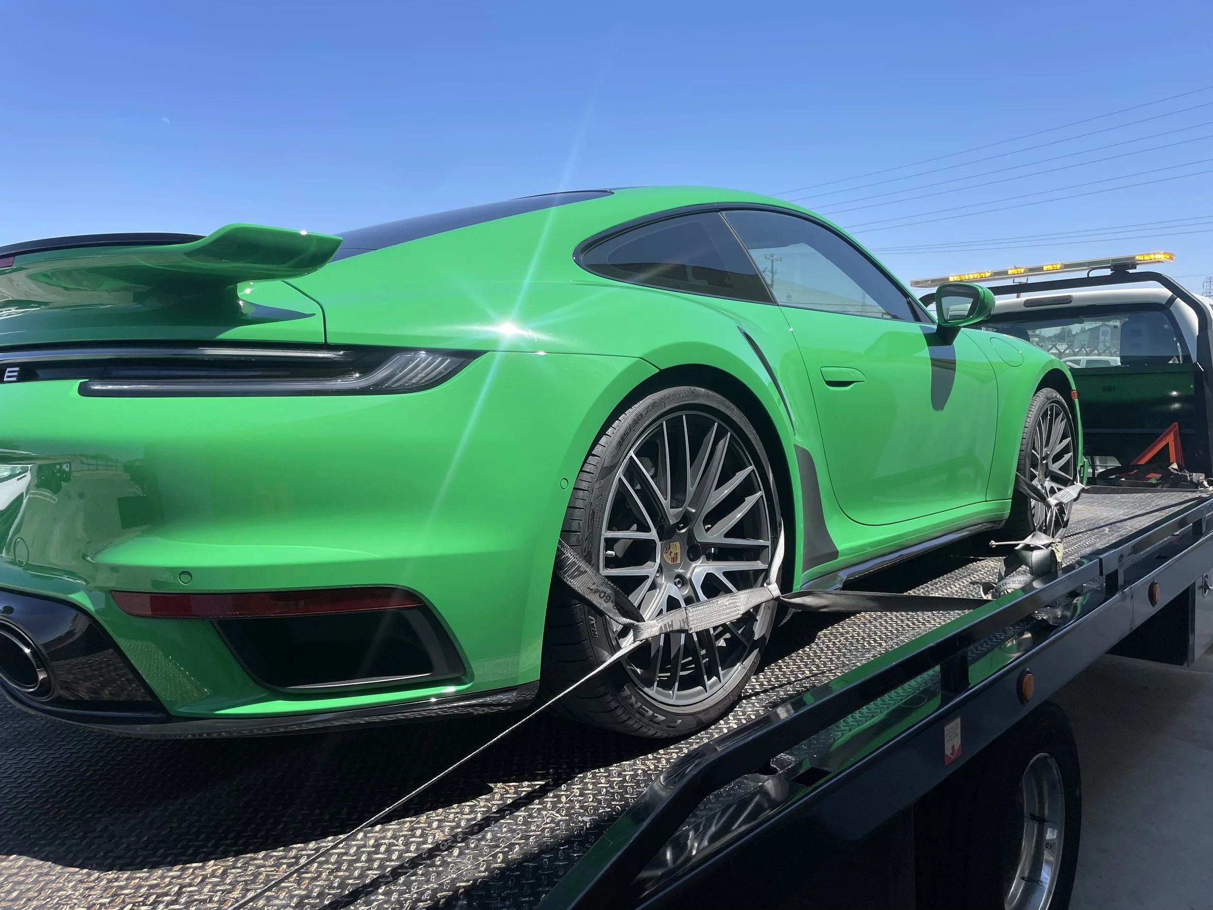 Tow Truck Near Me Antioch CA – Emergency flatbed towing service transporting a Porsche 911 in East Contra Costa County
